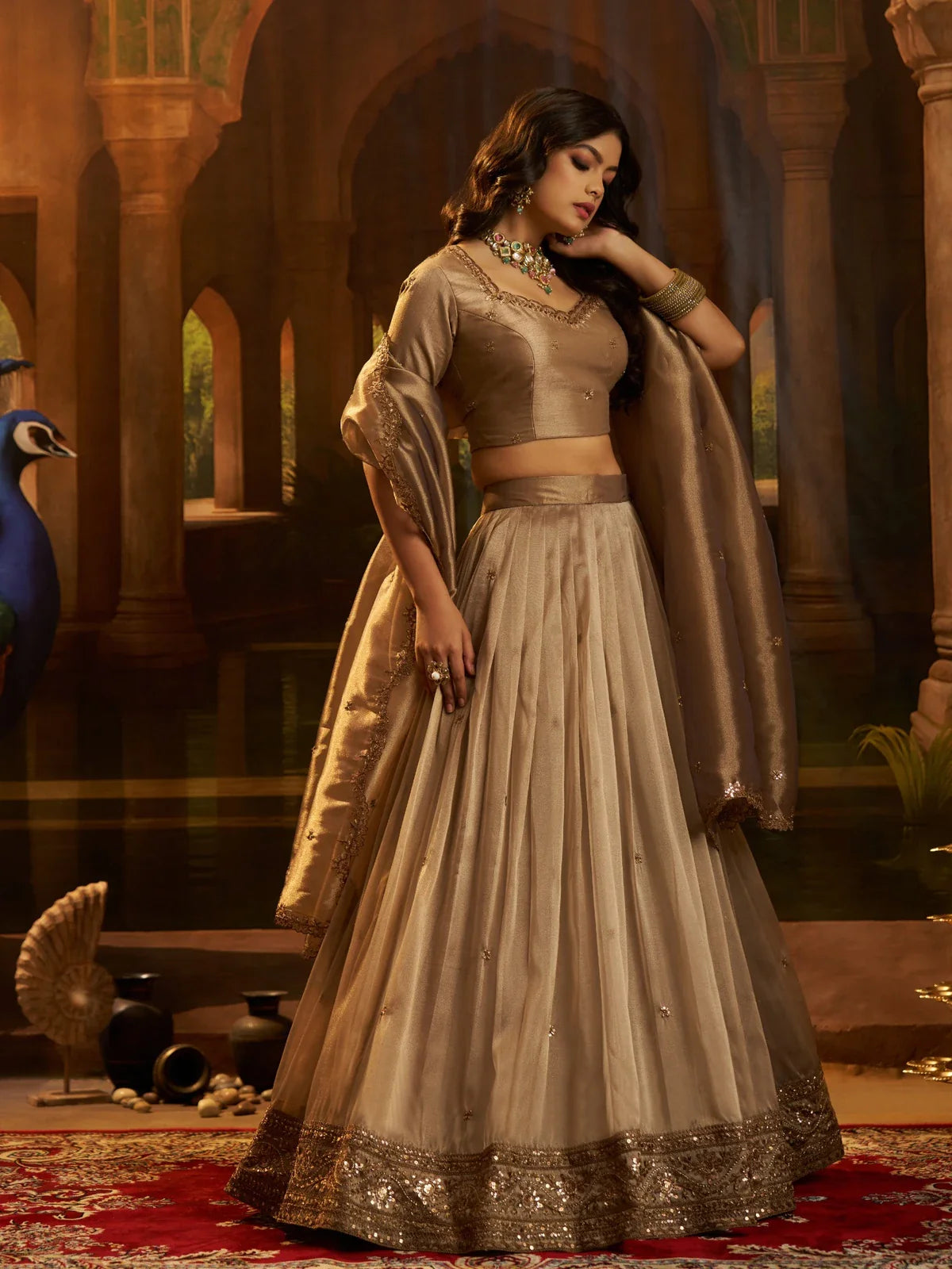 Tarani golden organza lehenga side pose showing blouse and flowing flare
