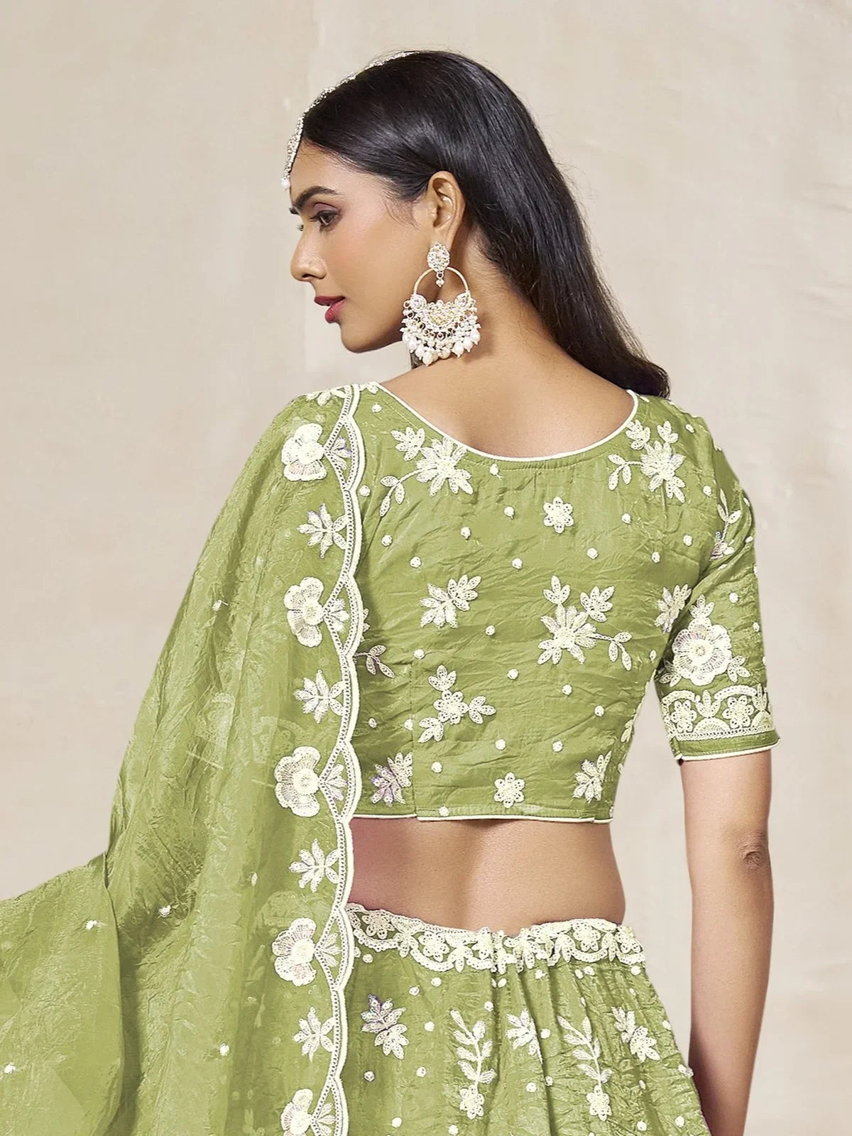 Tarani designer green organza lehenga back view with floral embroidery and blouse details