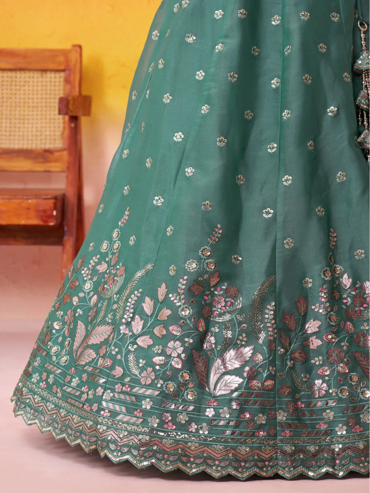 Tarani close-up of green lehenga floral embroidery and thread work on the border