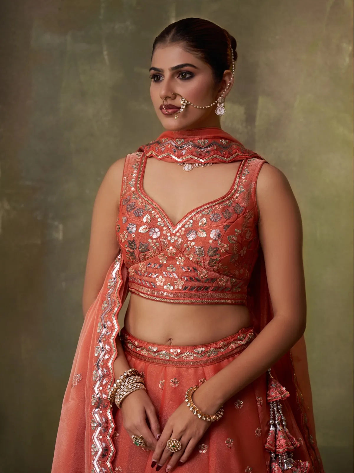 Tarani orange organza lehenga with embroidered sweetheart neckline blouse and delicate dupatta, premium Indian wear