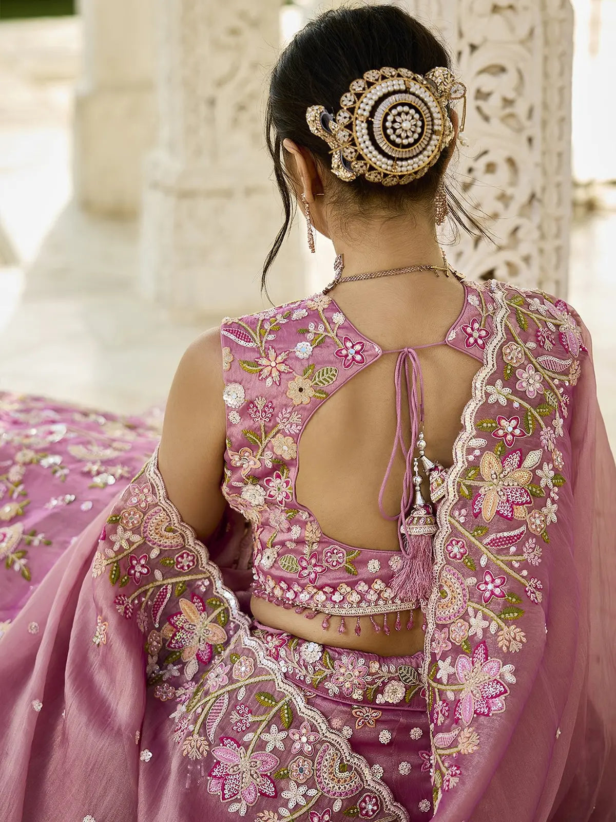 Tarani pink organza lehenga back view with embroidered blouse design and tassels