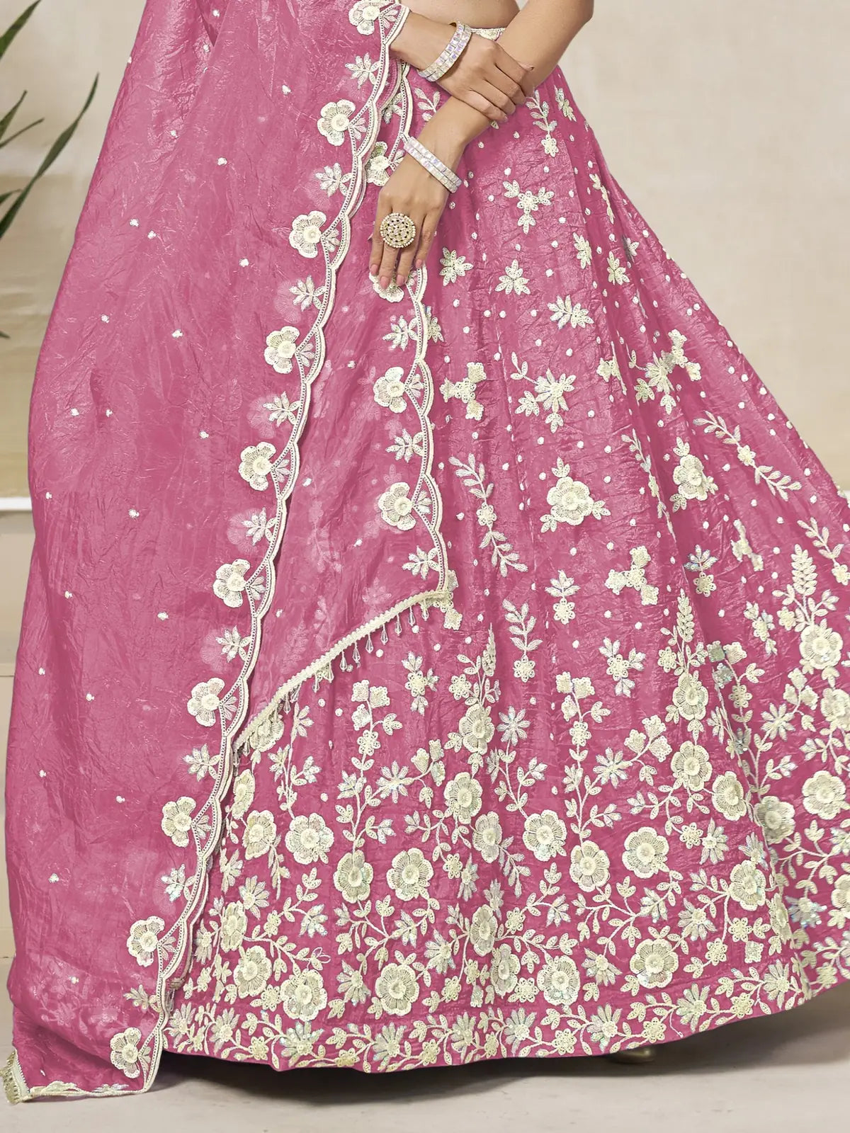 Tarani pink organza silk lehenga closeup view of embroidery and floral detailing