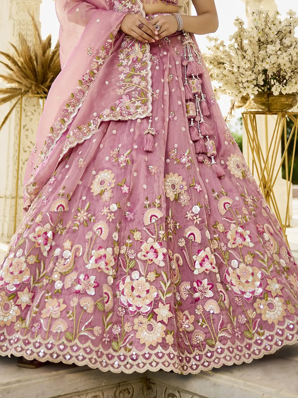 Tarani pink organza lehenga closeup view highlighting floral embroidery and sequins work