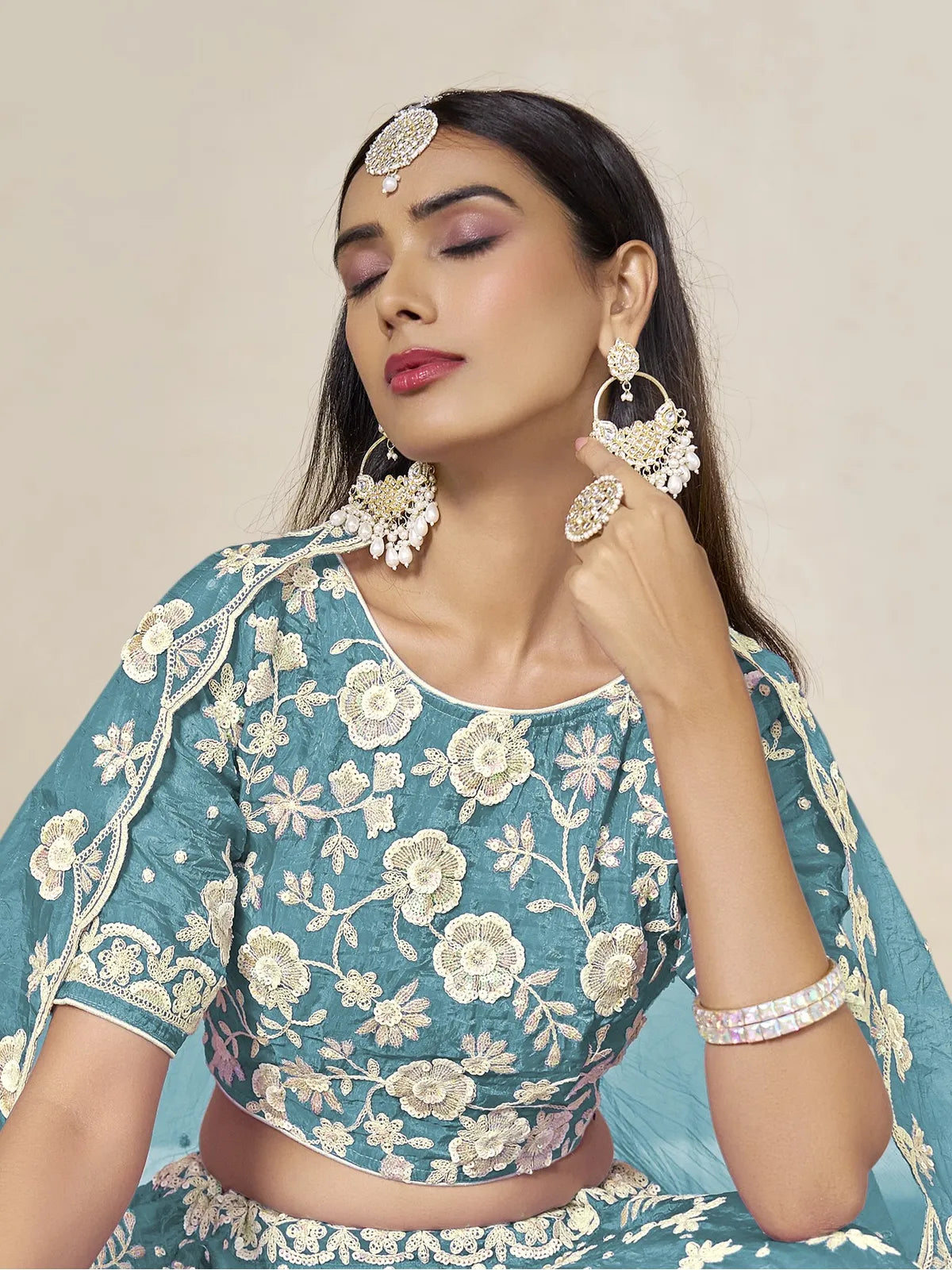 Tarani teal organza lehenga upper body close view with embroidered blouse