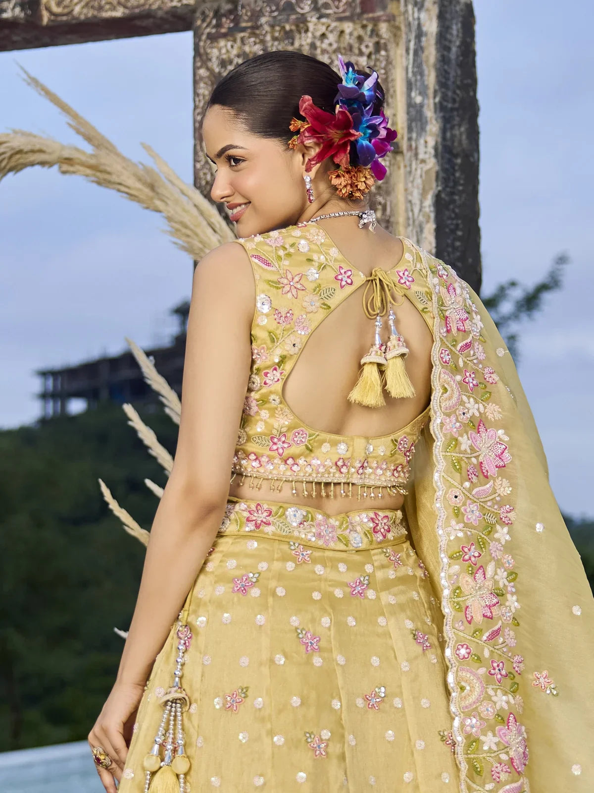 Tarani yellow organza lehenga with back blouse design embroidery back view