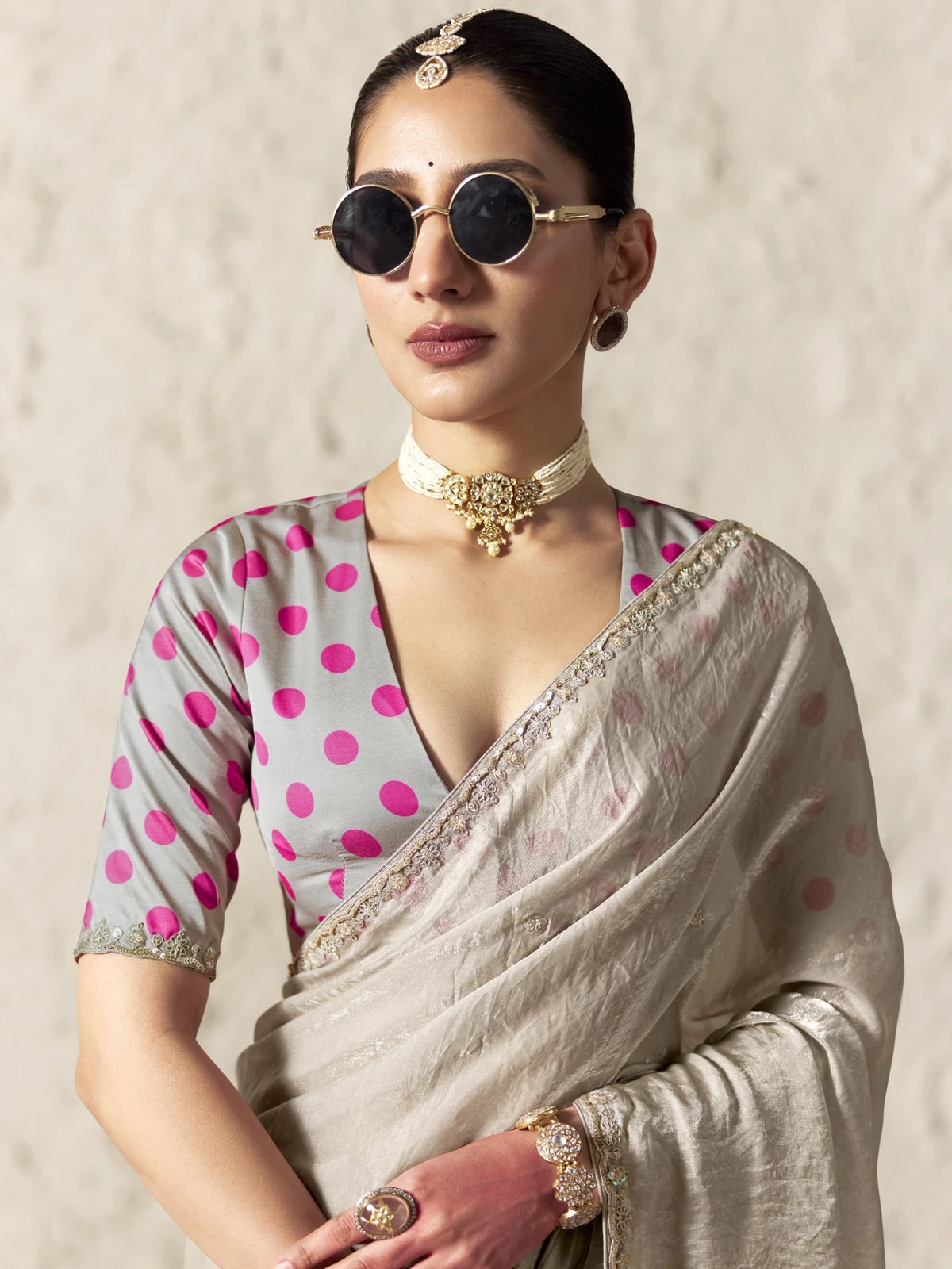 Tarani beige glass tissue organza saree upper body view with pink digital print blouse and jewellery