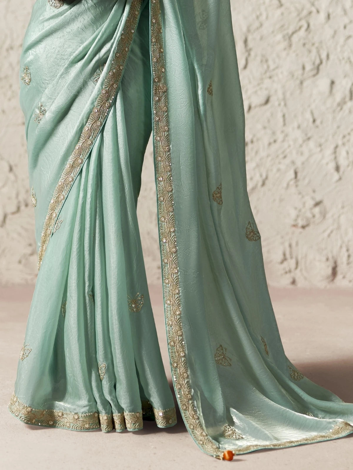 Tarani green organza saree pallu view with sequins embroidery and detailed border work