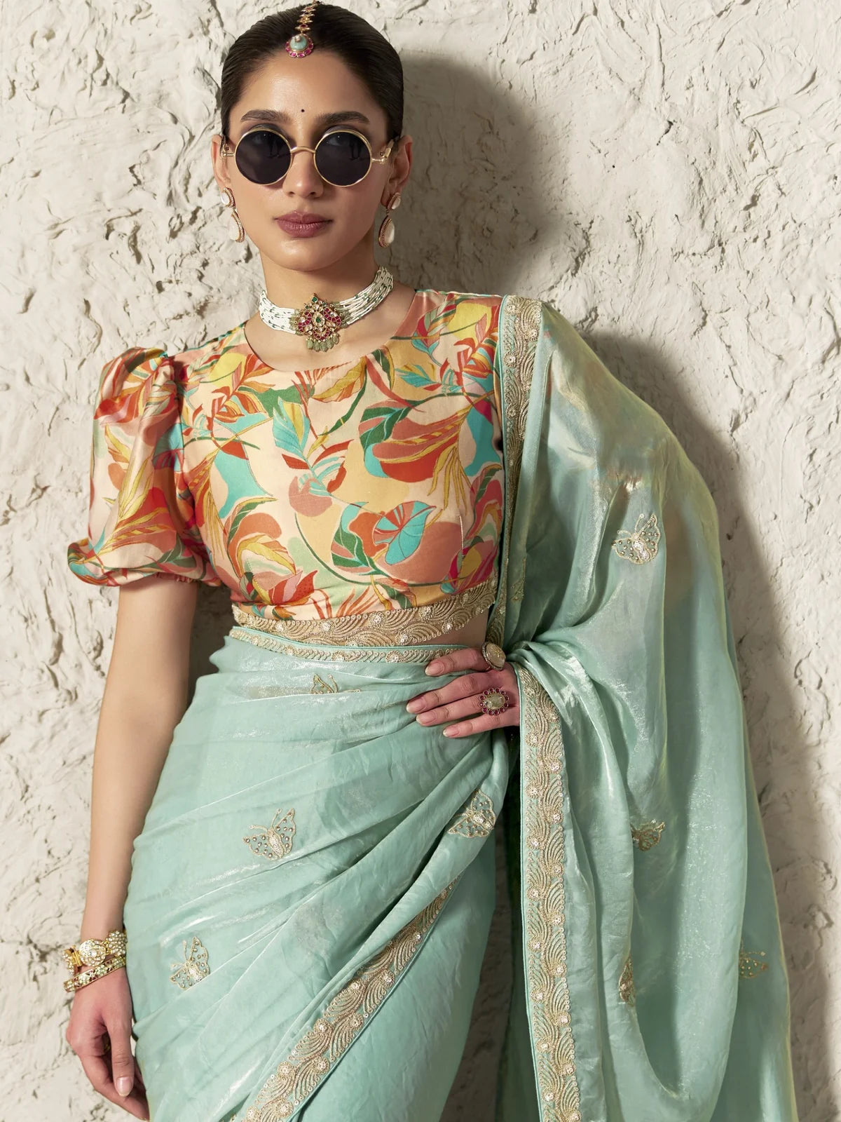 Tarani pastel green organza saree upper body view with floral blouse and embroidery lace detailing