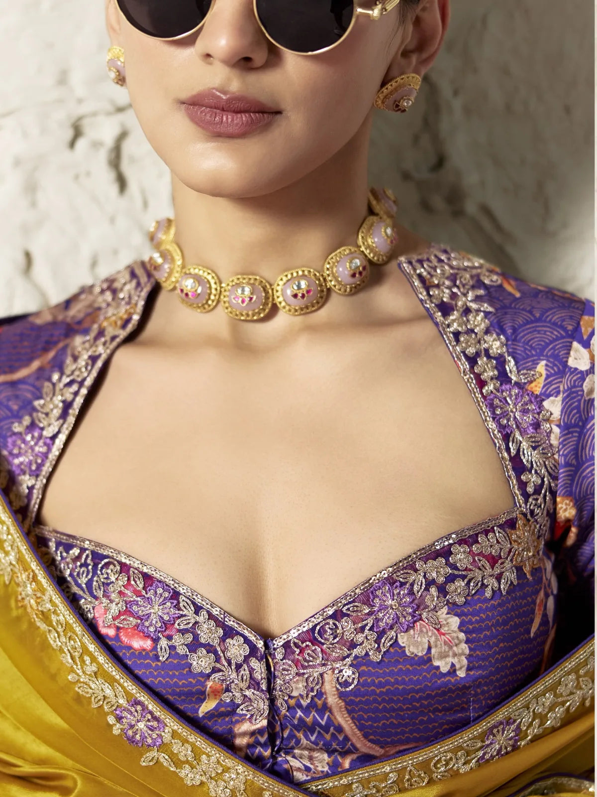 Tarani mustard saree blouse view with purple embroidered designer blouse and jewellery styling