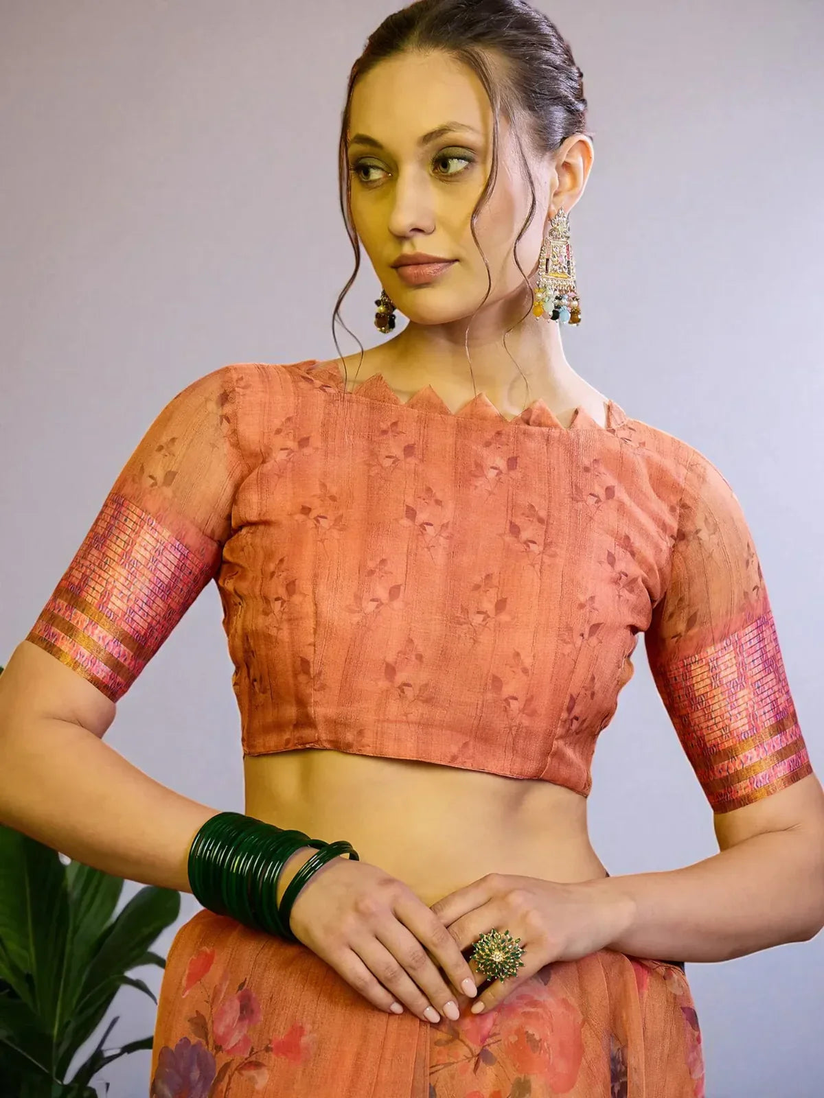 Tarani orange floral organza saree blouse view with embroidered elbow sleeve blouse