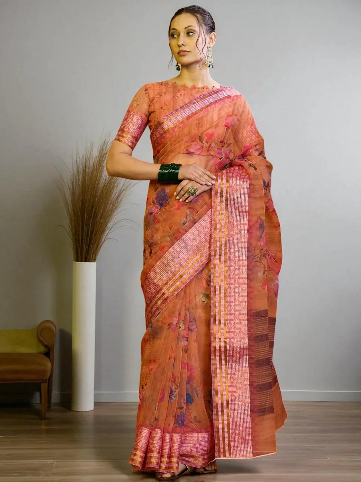 Tarani orange organza saree with floral print and pink striped border front view
