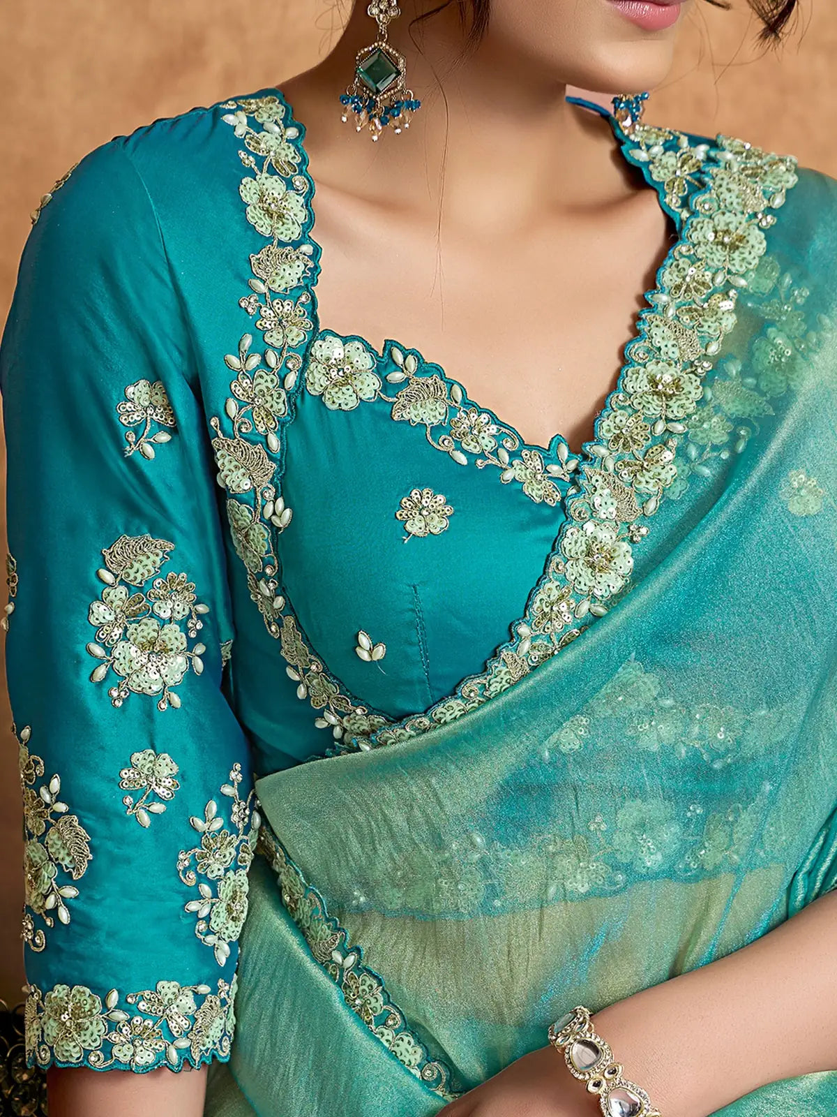 Tarani teal Zari Organza Satin saree with sequin pearl stone embroidery closeup view Archaya