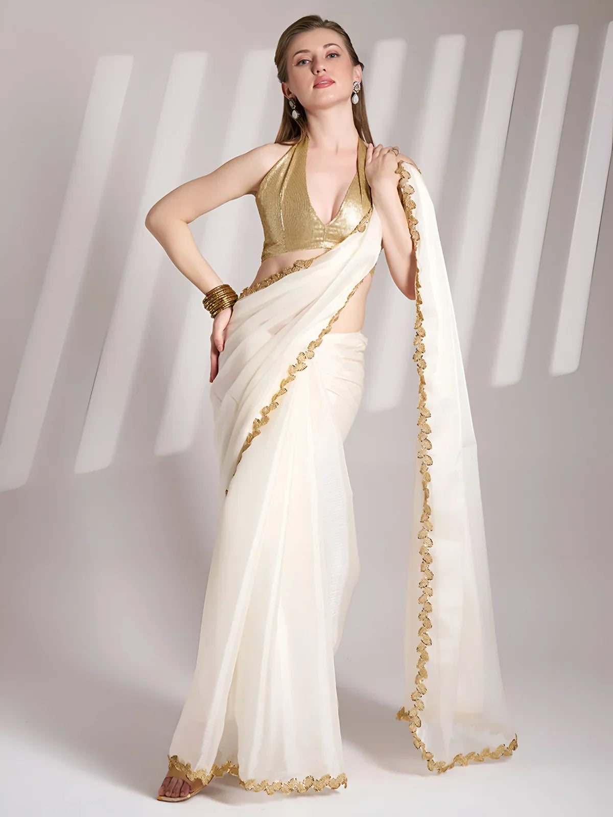 Tarani white Chimmy Choo organza saree with golden border and stylish blouse front view