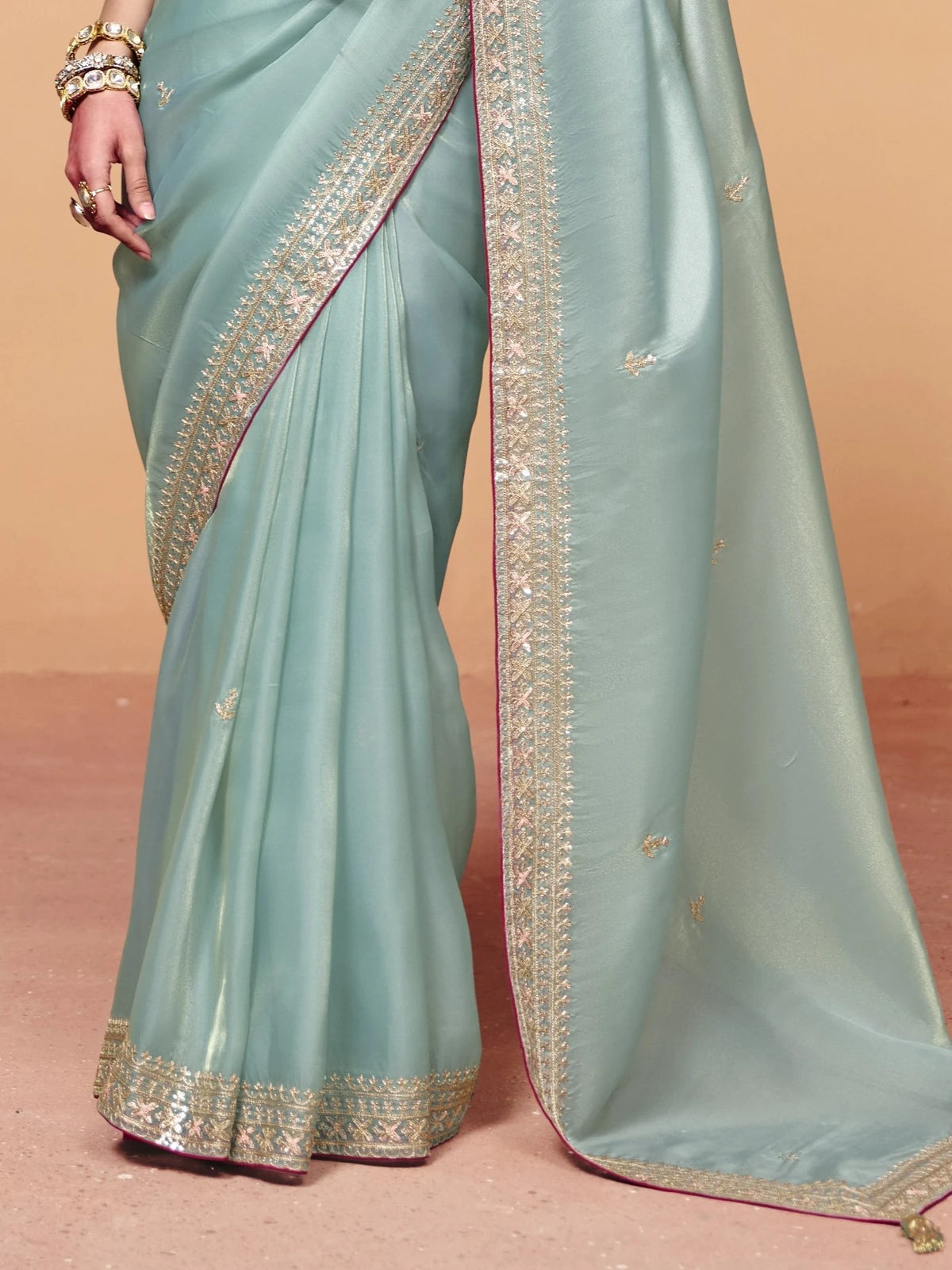 Tarani pastel green embroidered organza satin saree pallu and border detail closeup