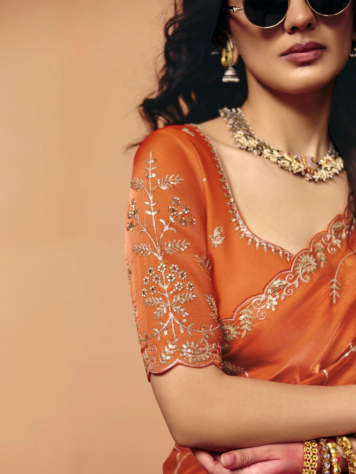 Tarani orange organza satin saree blouse embroidery closeup for festive wear