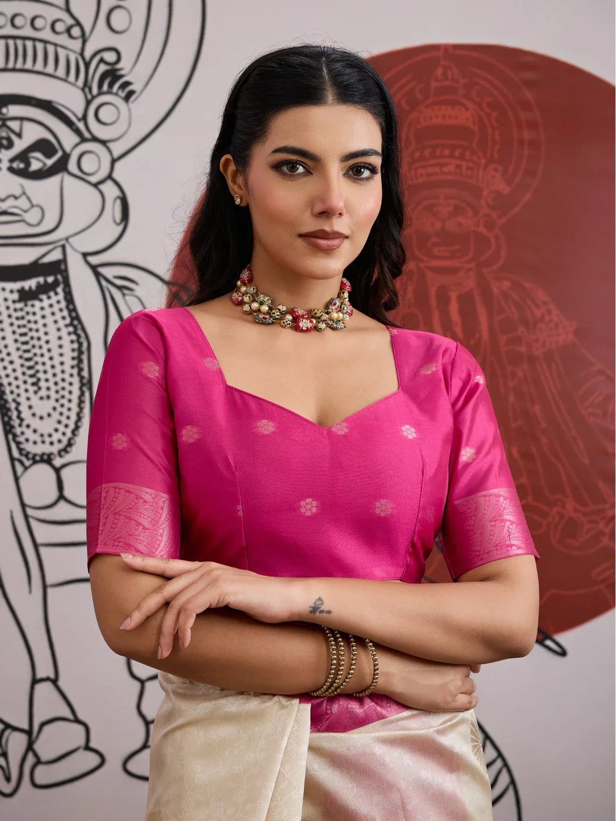 Tarani paper silk saree upper body closeup with pink blouse and ethnic jewellery