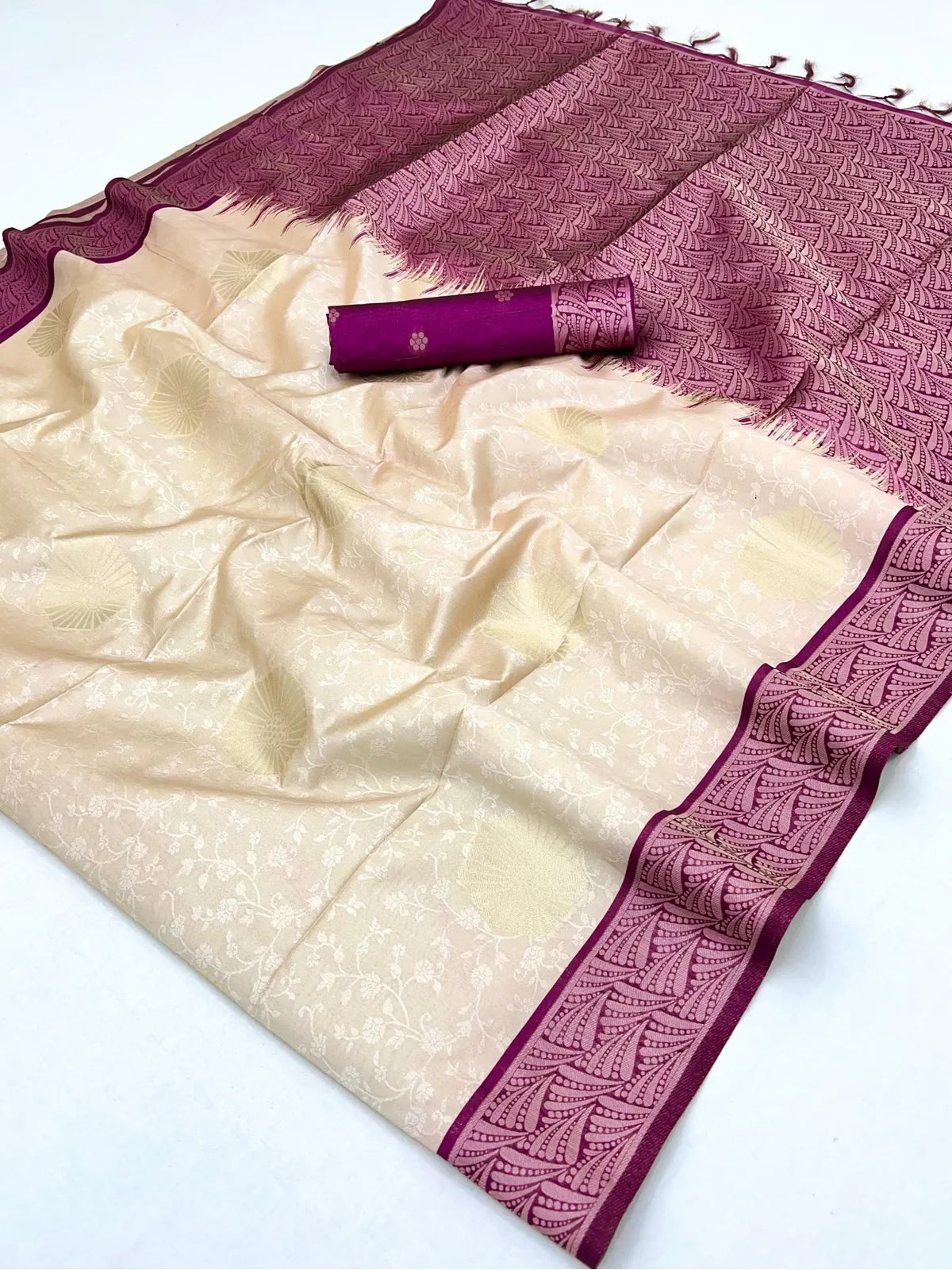 Tarani saree pallu view showing plum woven design and tassels in paper silk fabric