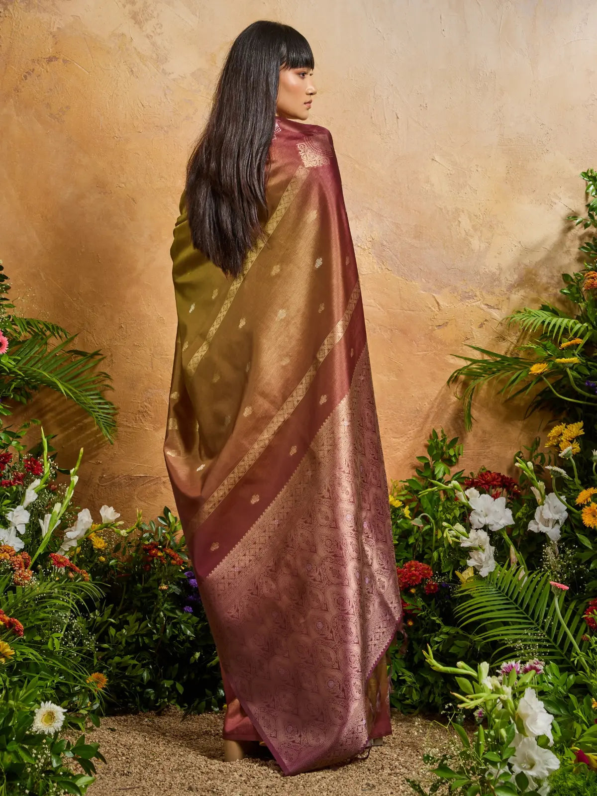 Tarani traditional handloom saree with soft paper silk drape and regal dual-tone finish from the back