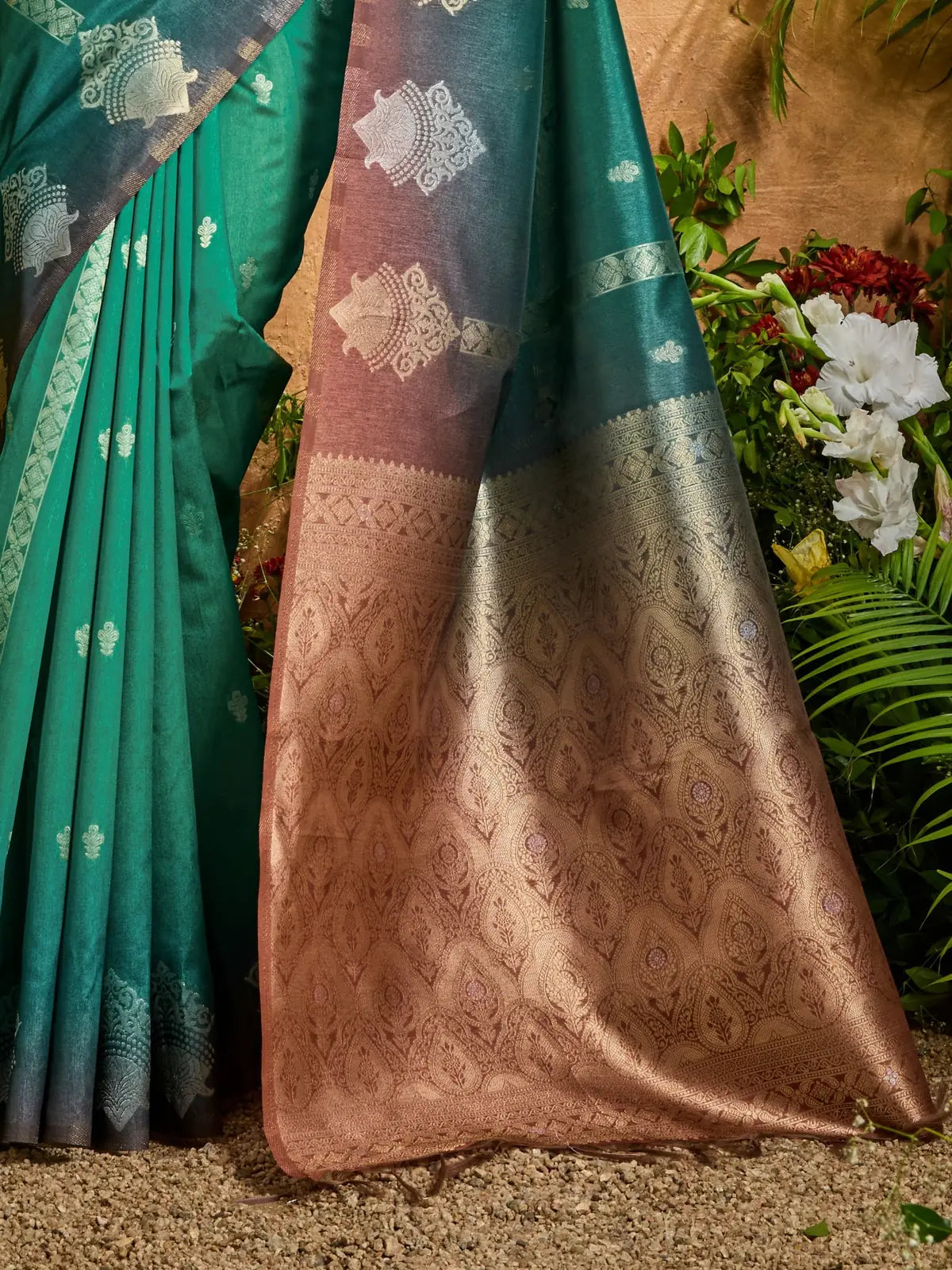 Tarani closeup of green handloom saree with zari border and texture detailing