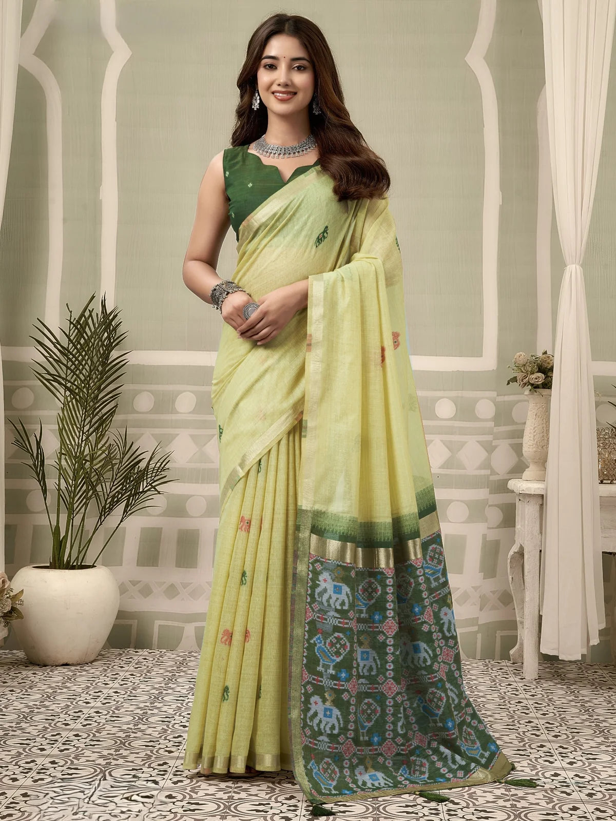 Tarani light green Patola saree with woven zari border full view and fancy tassels