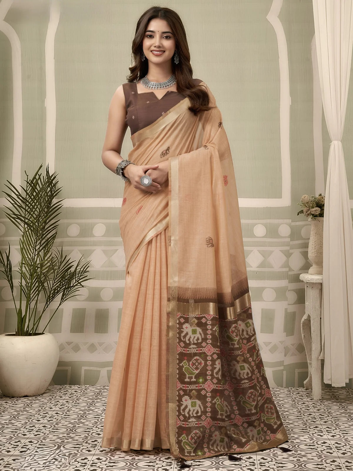 Tarani peach Patola saree full view with woven zari border and fancy tassels