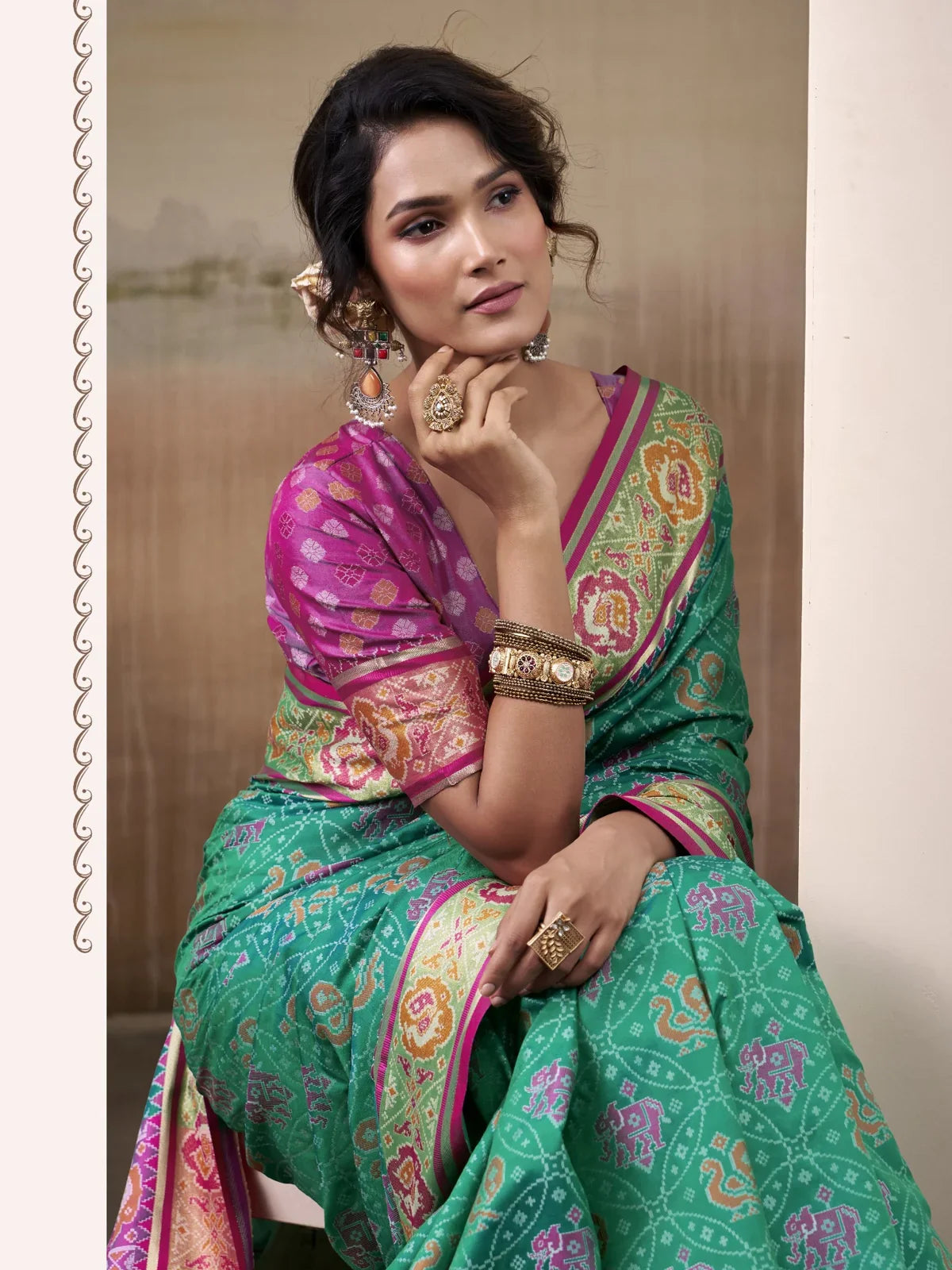 Tarani stylish green Patola silk saree front view showcasing woven motifs and rich festive detailing