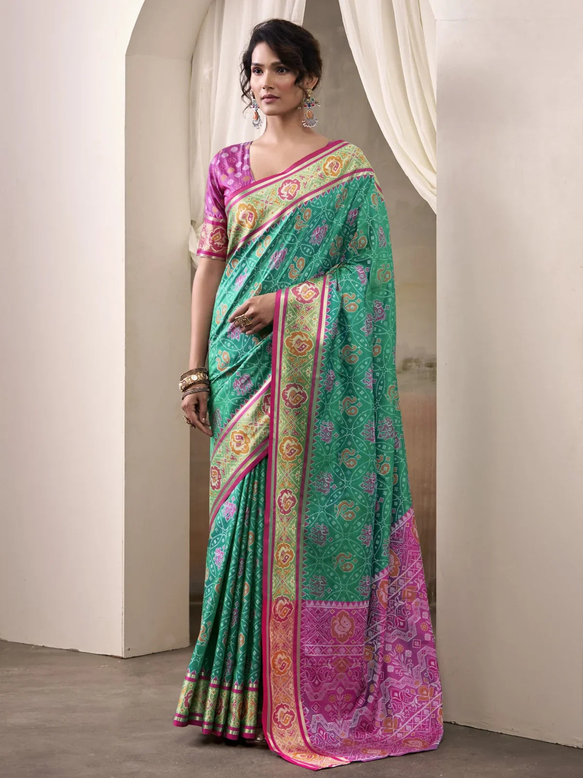 Tarani premium green Patola silk saree full view with woven blouse for festive and wedding occasions