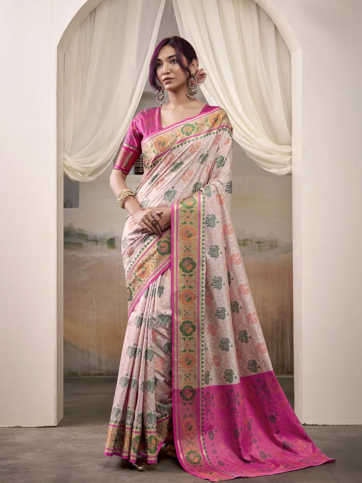 Tarani pink patola silk saree full view with woven motifs and festive style