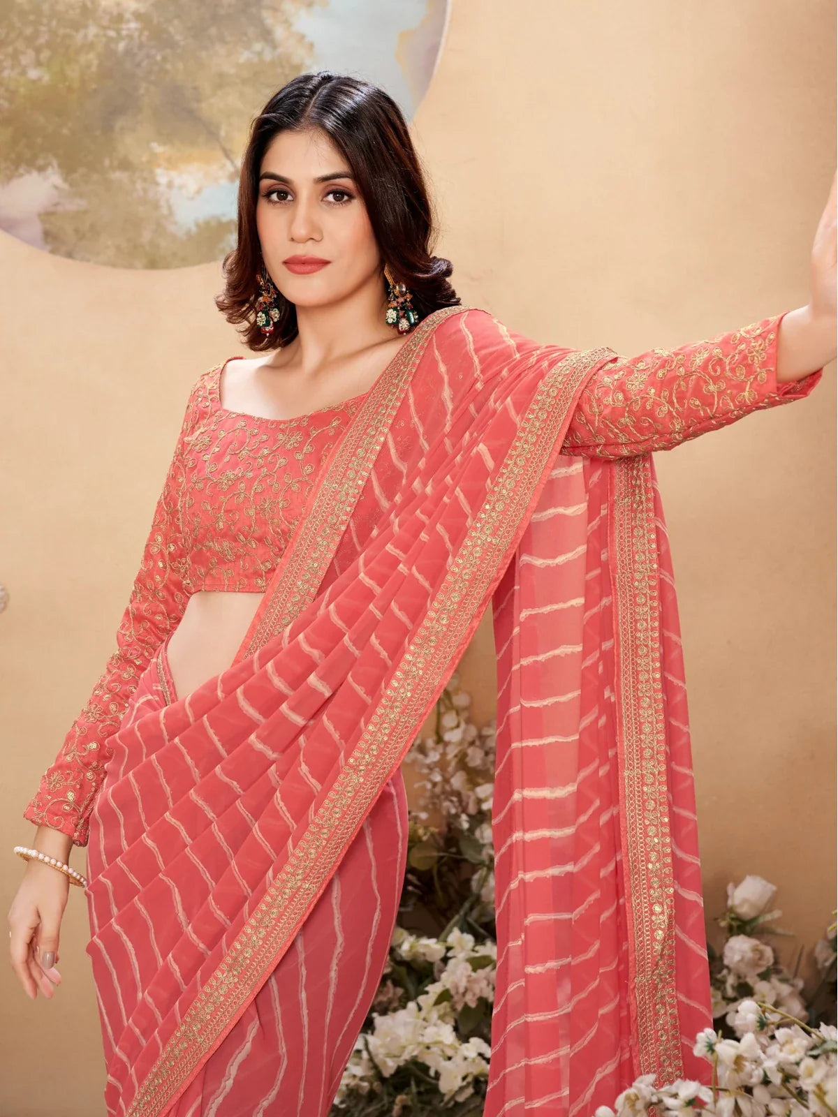 Tarani coral leheriya poly georgette saree close-up upper body view