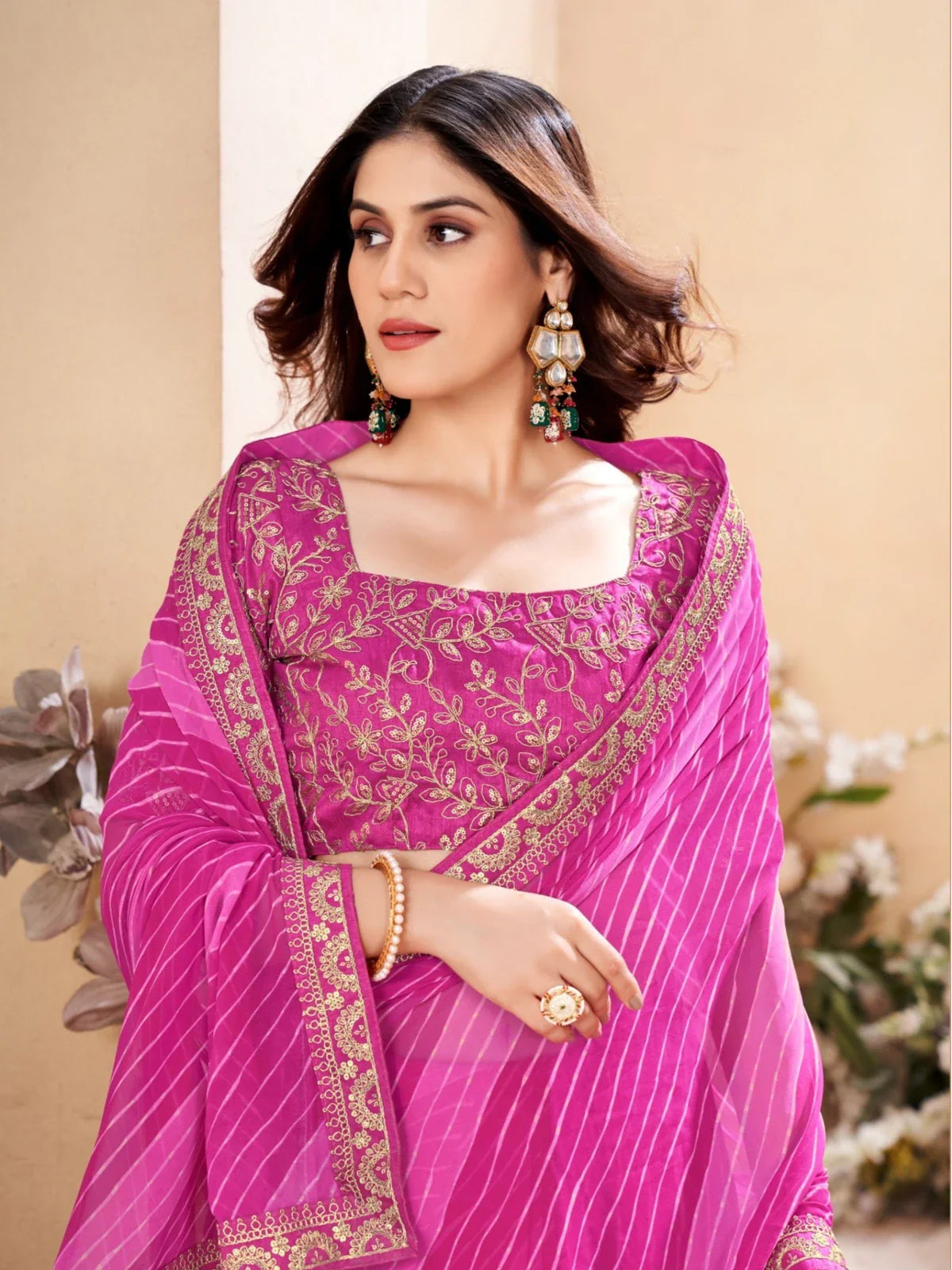 Tarani pink leheriya saree upper body close-up showing blouse embroidery