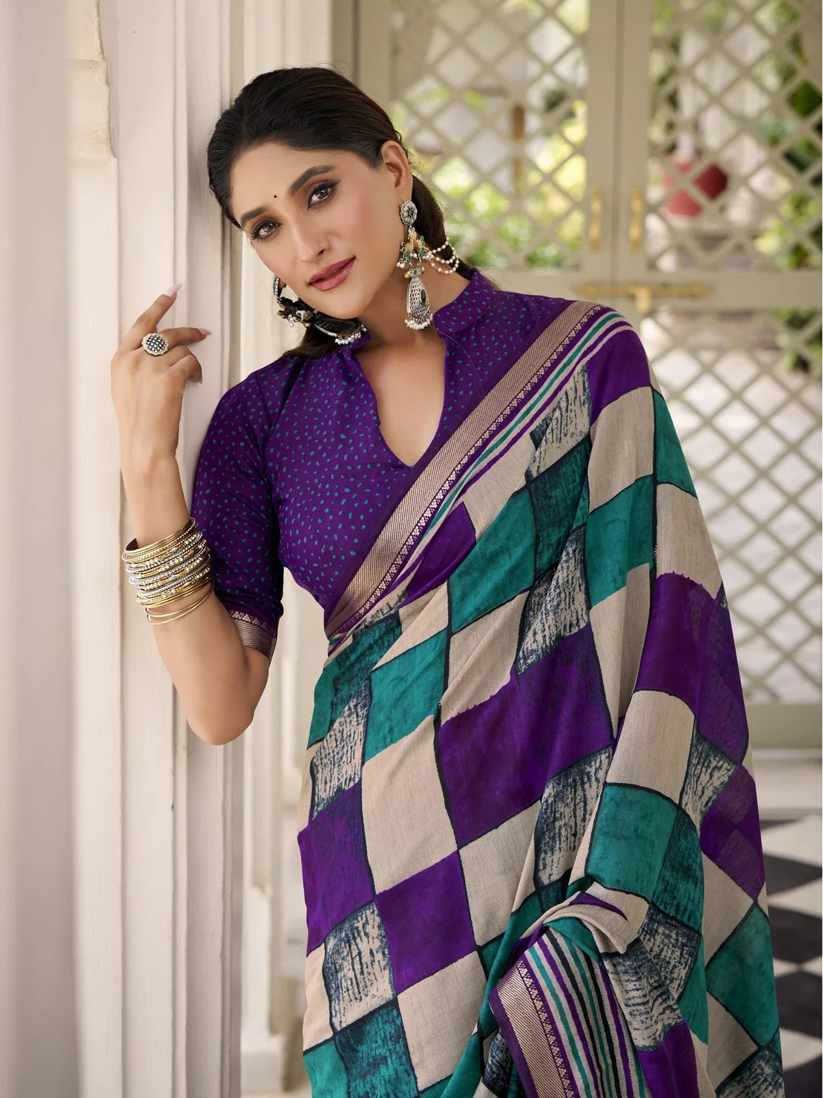 Tarani purple polyester viscose saree close-up showing neckline and blouse design