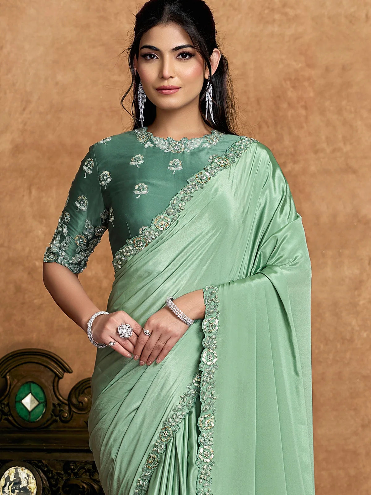 Tarani Durvanka pure crepe satin green saree front view with floral sequin and pearl embellished border