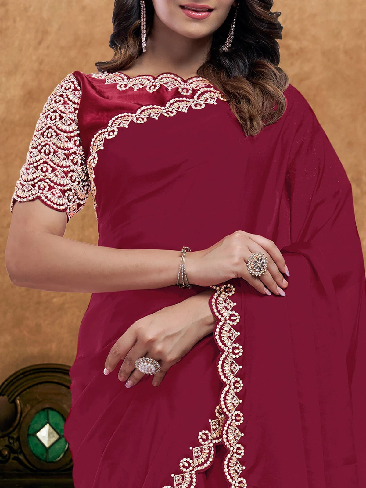 Tarani Mitasha maroon saree closeup showcasing border embroidery and elegant drape