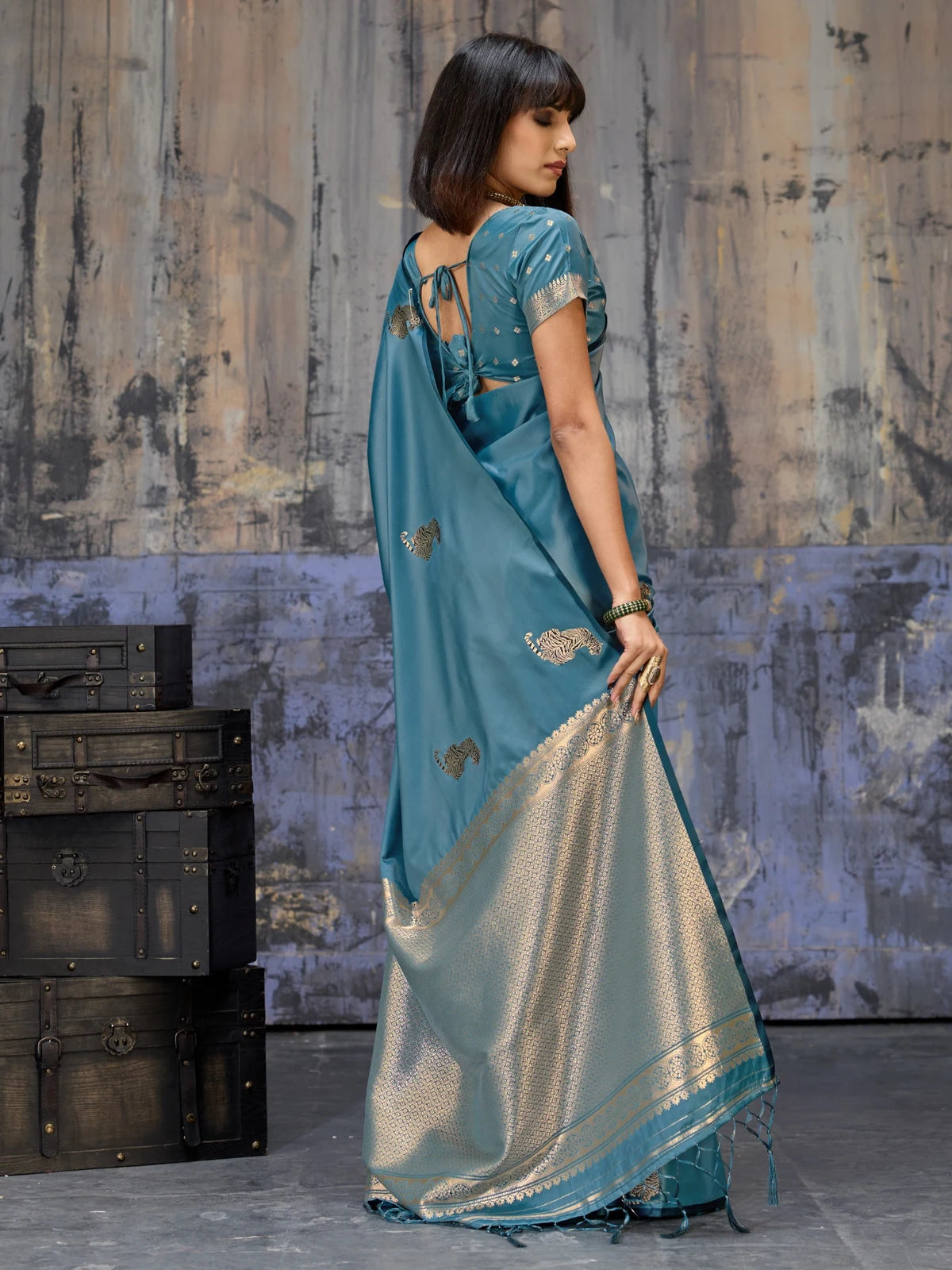 Tarani teal satin handloom saree back view with woven blouse detailing and rich pallu