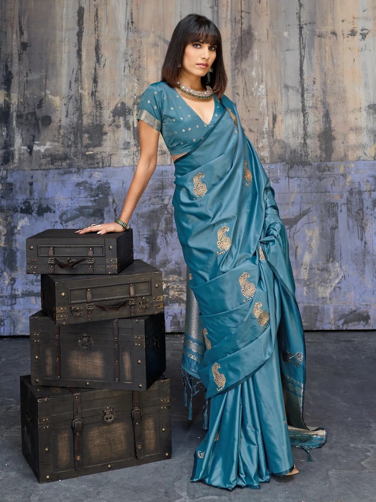 Tarani teal party wear satin saree with rich woven pallu and stylish front drape view