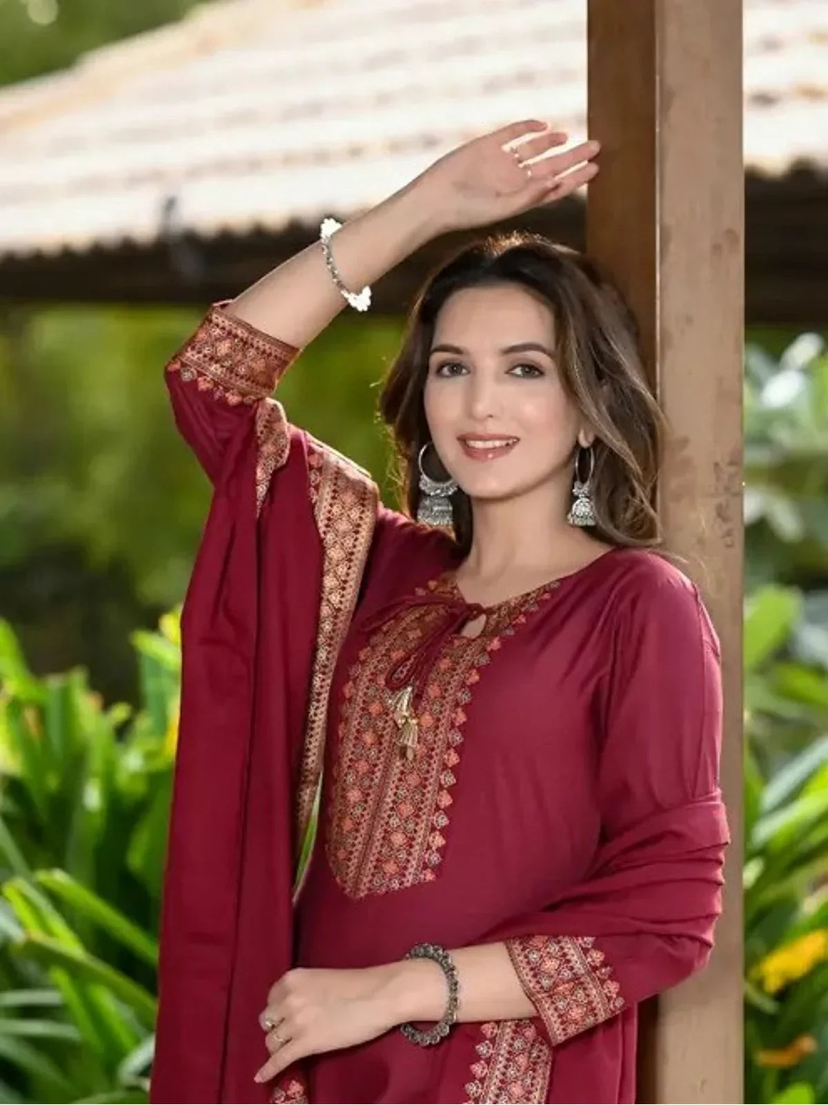 Tarani rayon maroon dress close-up with festive neckline khadi print and earrings