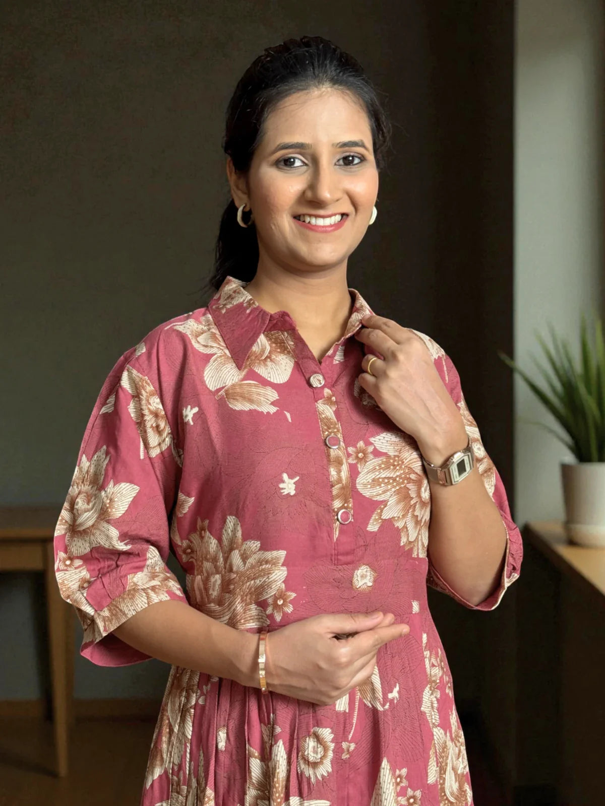 Tarani maroon rayon midi dress with floral prints in upper body closeup highlighting collar and buttons