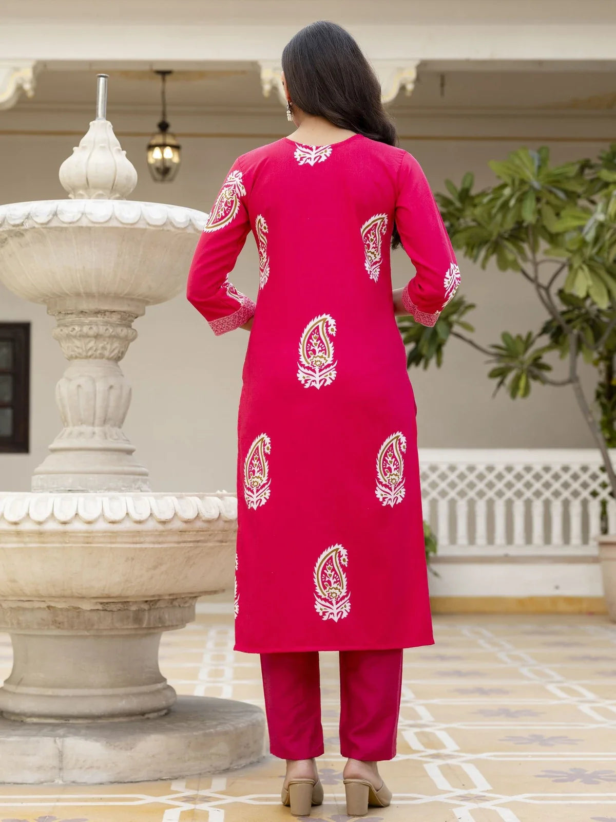 Back view of pink rayon kurti set with printed motifs by Tarani