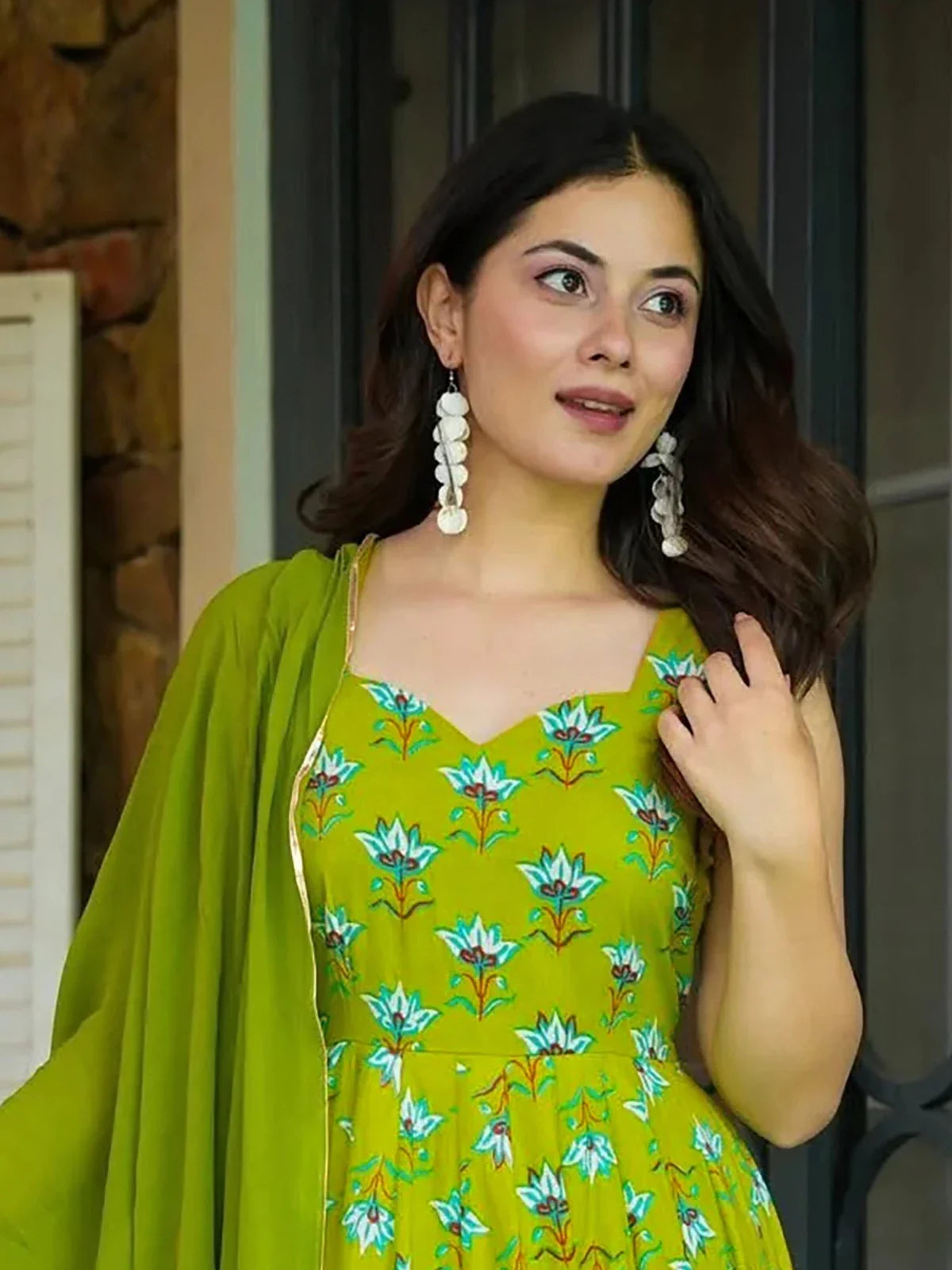 Tarani green rayon gown upper body view showing floral print neckline and elegant drape