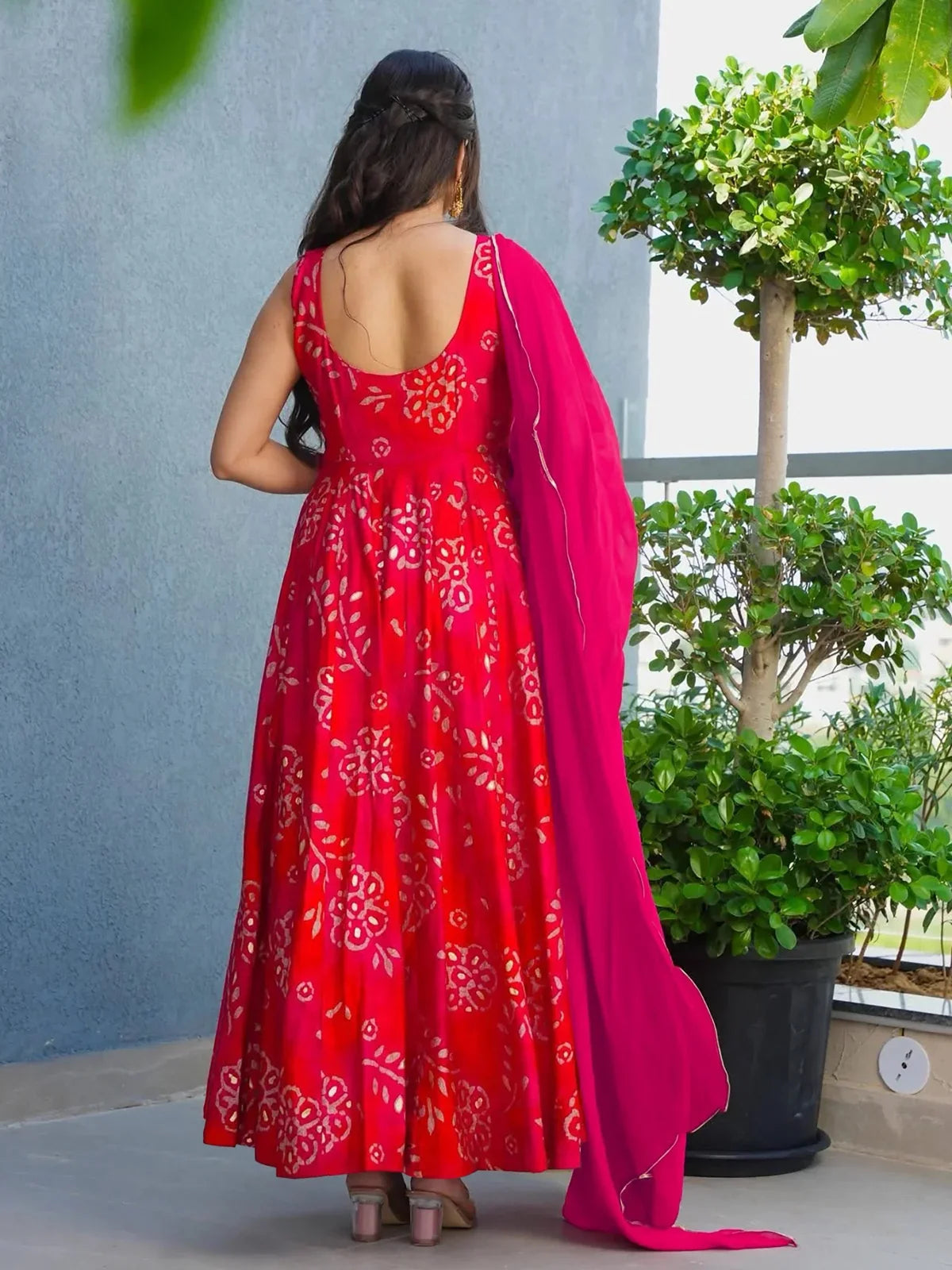 Tarani rayon pink gown with scooped back design and floral digital prints back view