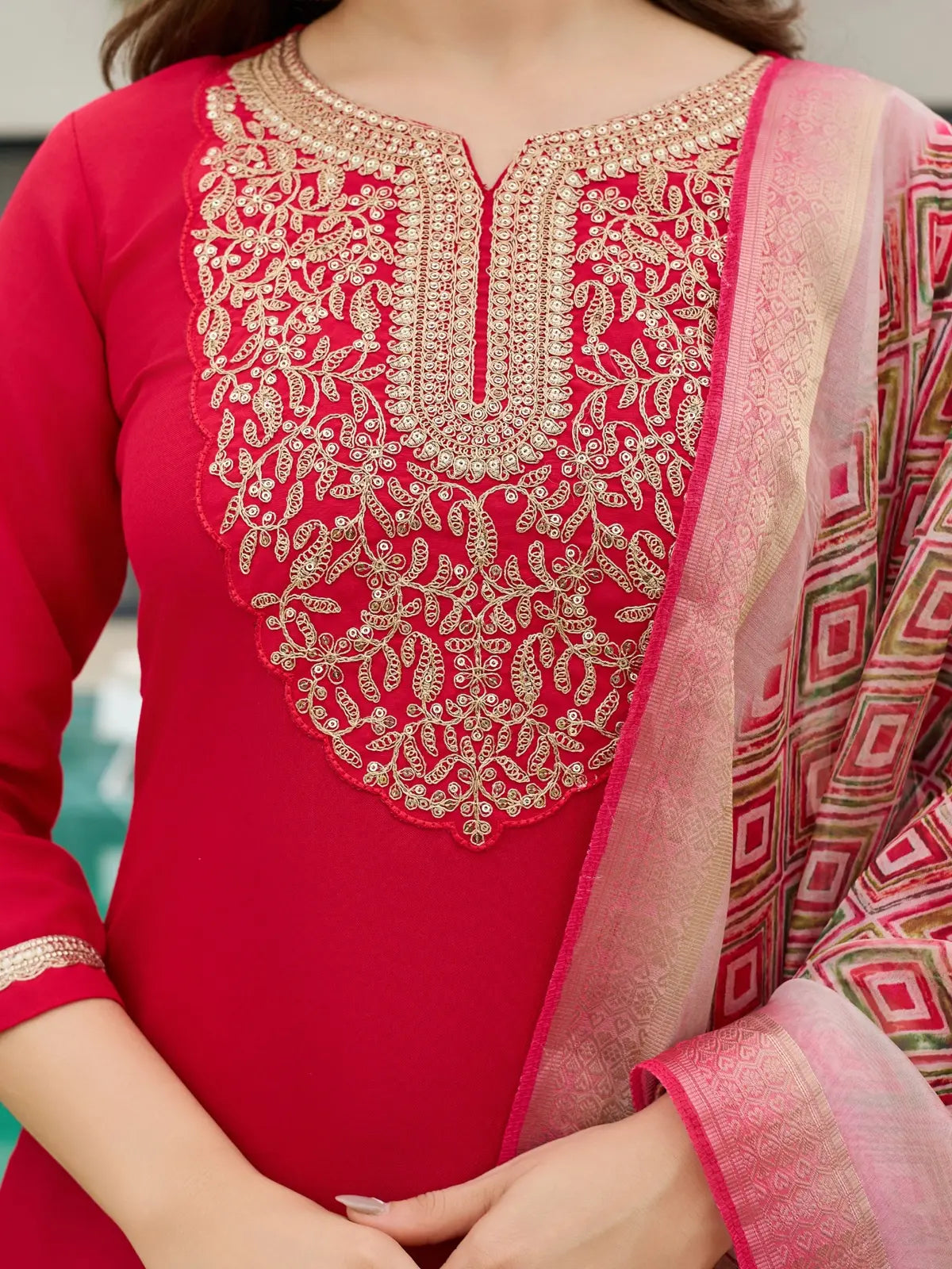 Tarani red rayon slub kurta set closeup view of golden embroidery and dupatta pattern