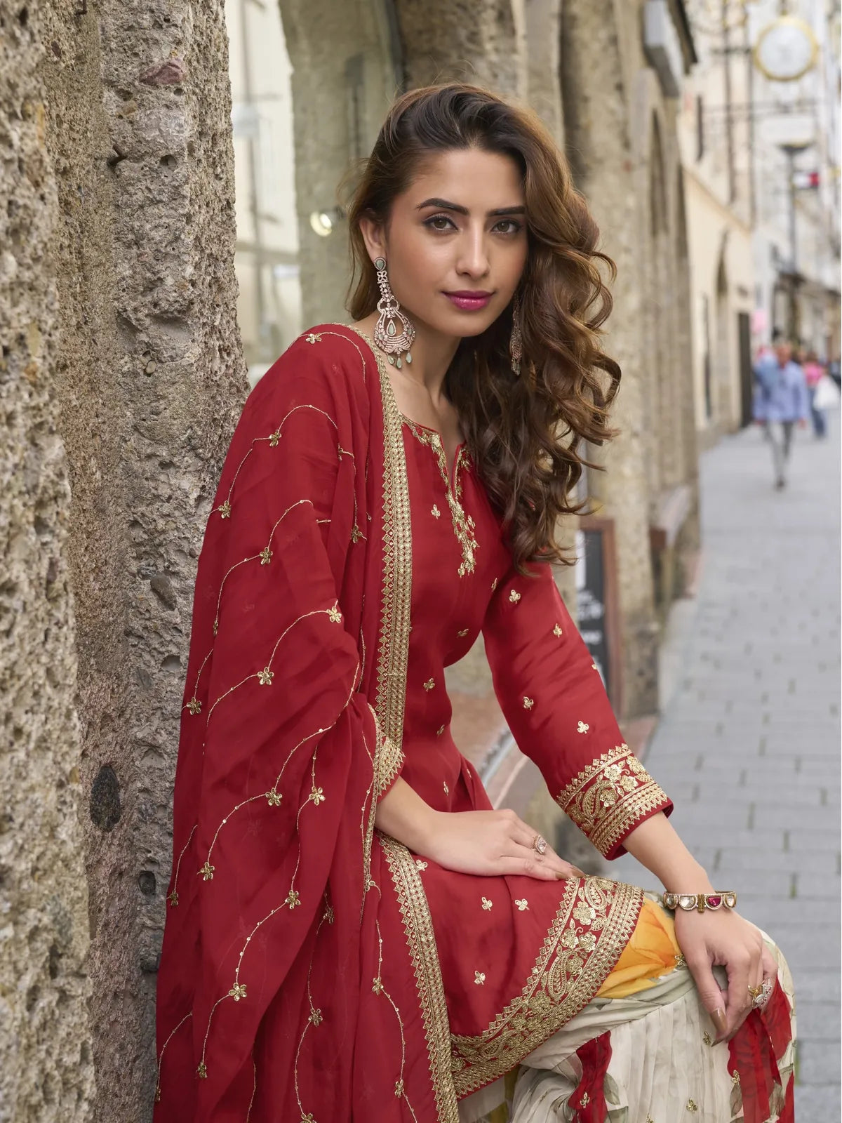 Tarani premium red Real Chinon sharara suit elegant side pose view
