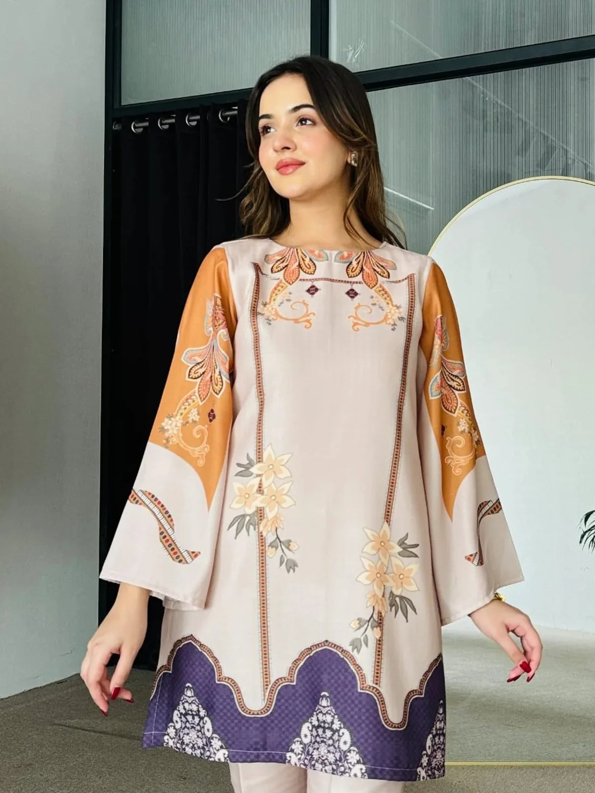 Tarani printed beige kurti front view showing neckline and sleeve embroidery