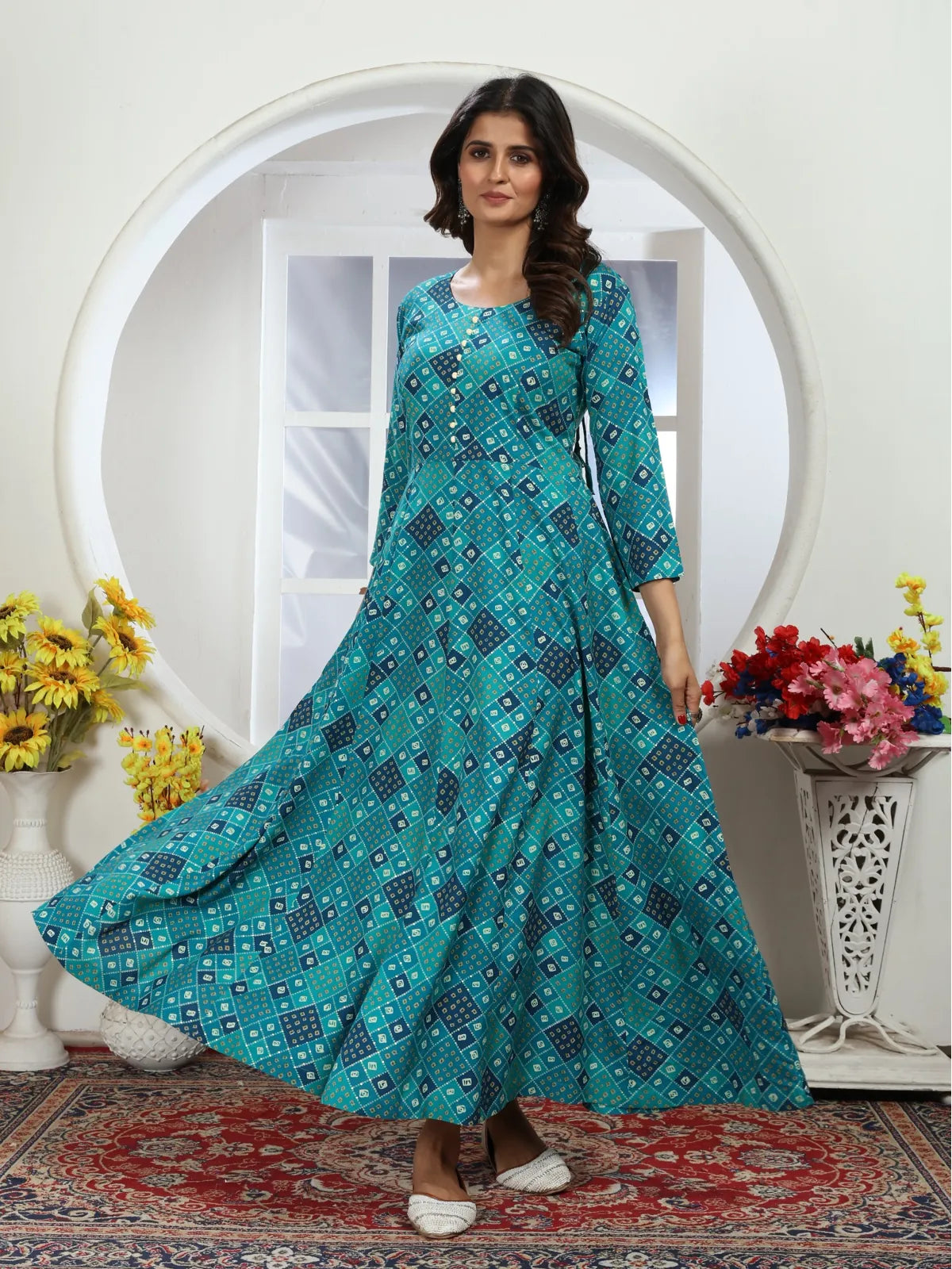 Tarani green Riyon gown full view showing flowy flare and ethnic pattern