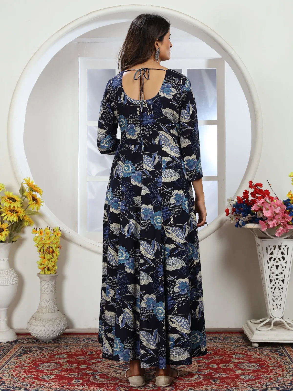 Tarani navy blue riyon gown back view with tie-up and floral design