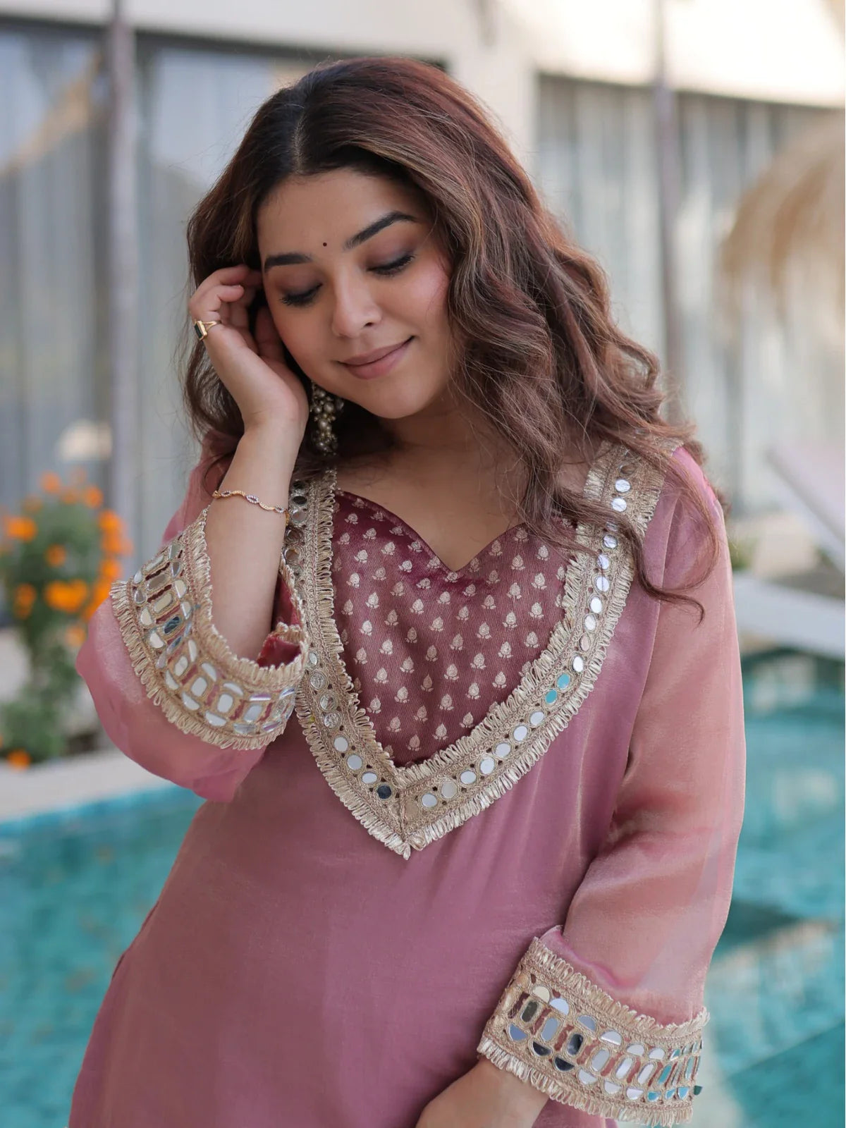 Tarani ethnic gown in soft pink with mirror neckline and bell sleeves – upper body close-up view