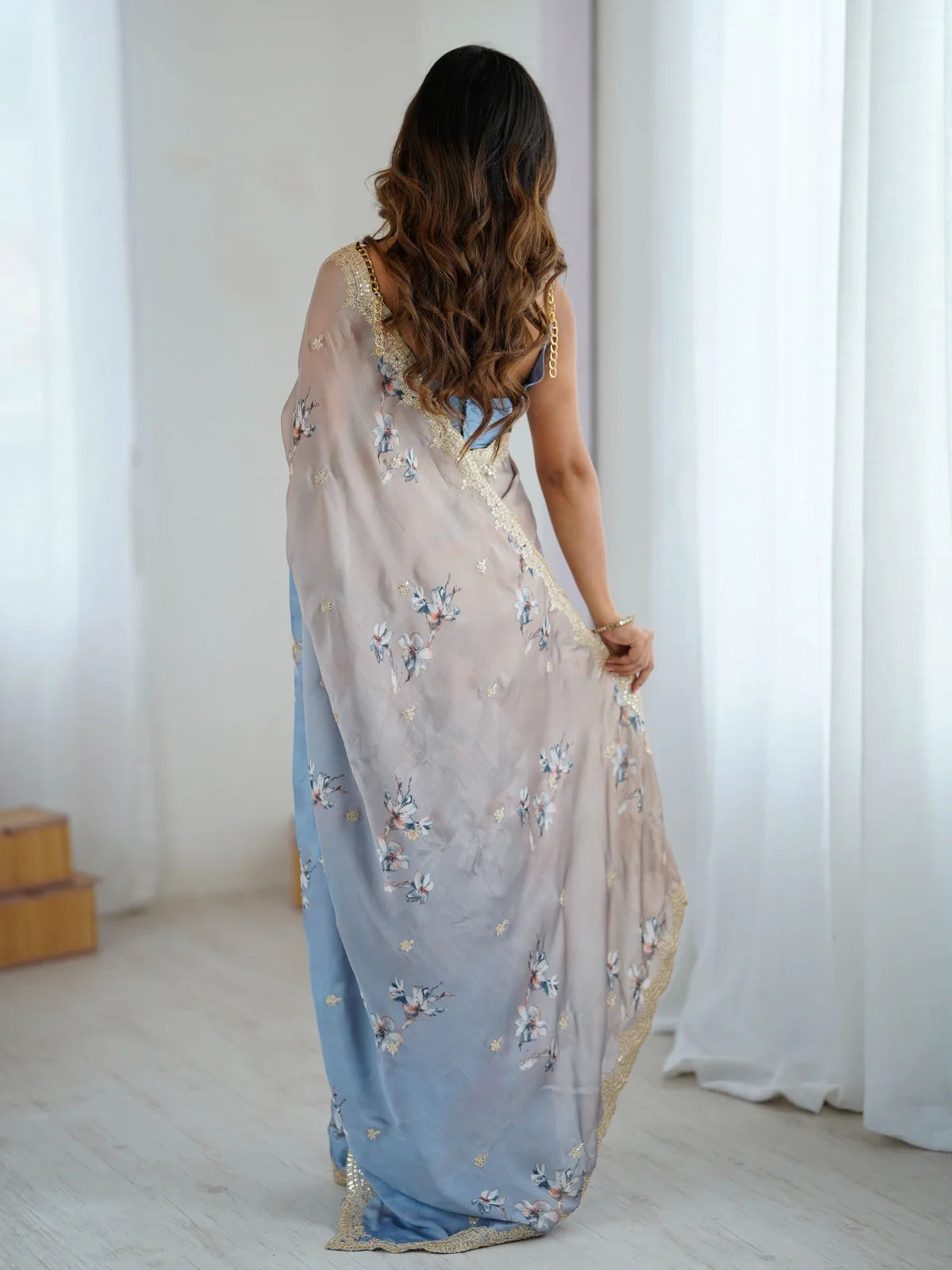 Tarani back view satin chiffon saree with flowing drape and floral design