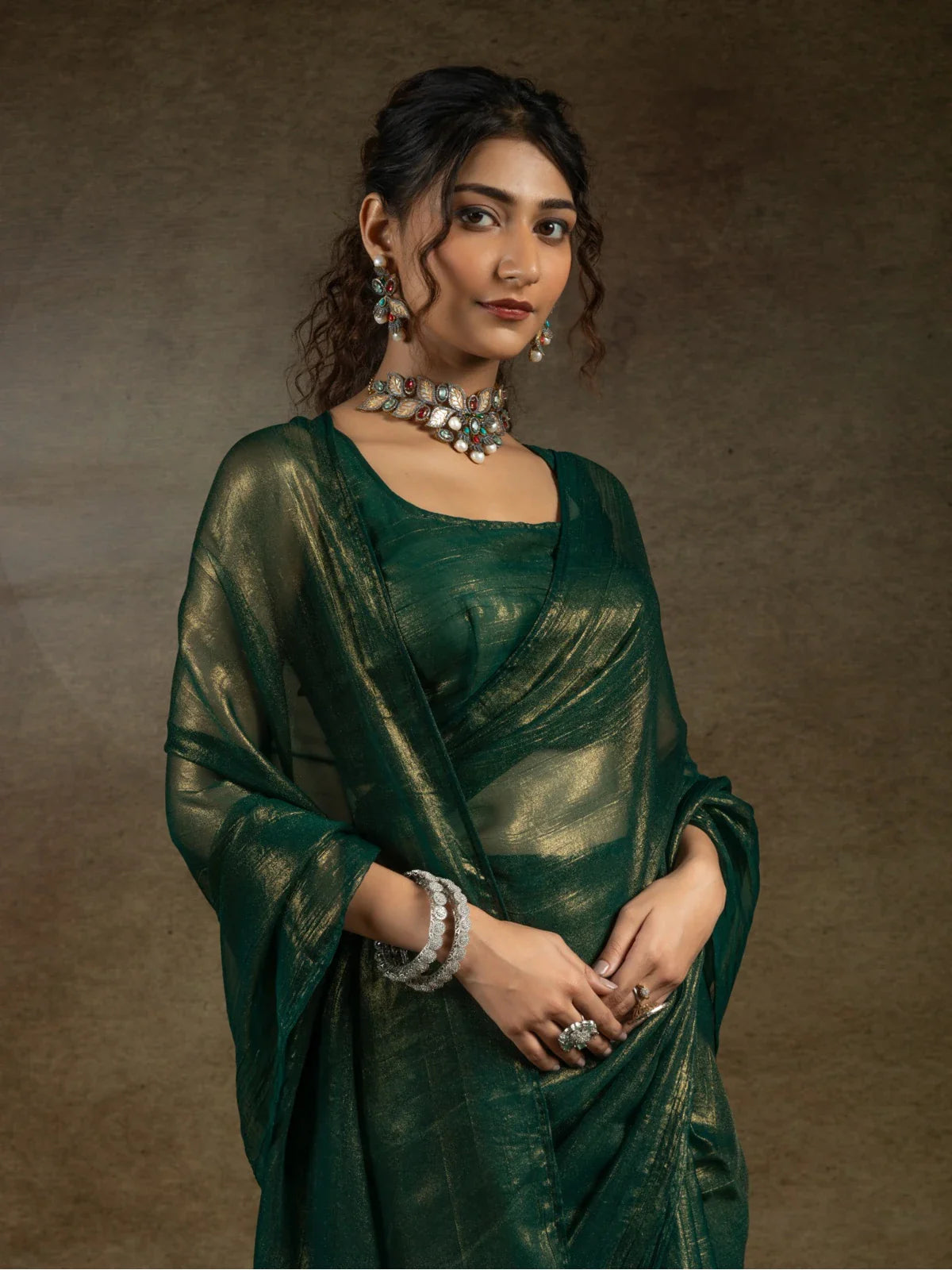 Tarani satin chiffon saree green upper-body closeup with jewellery styling