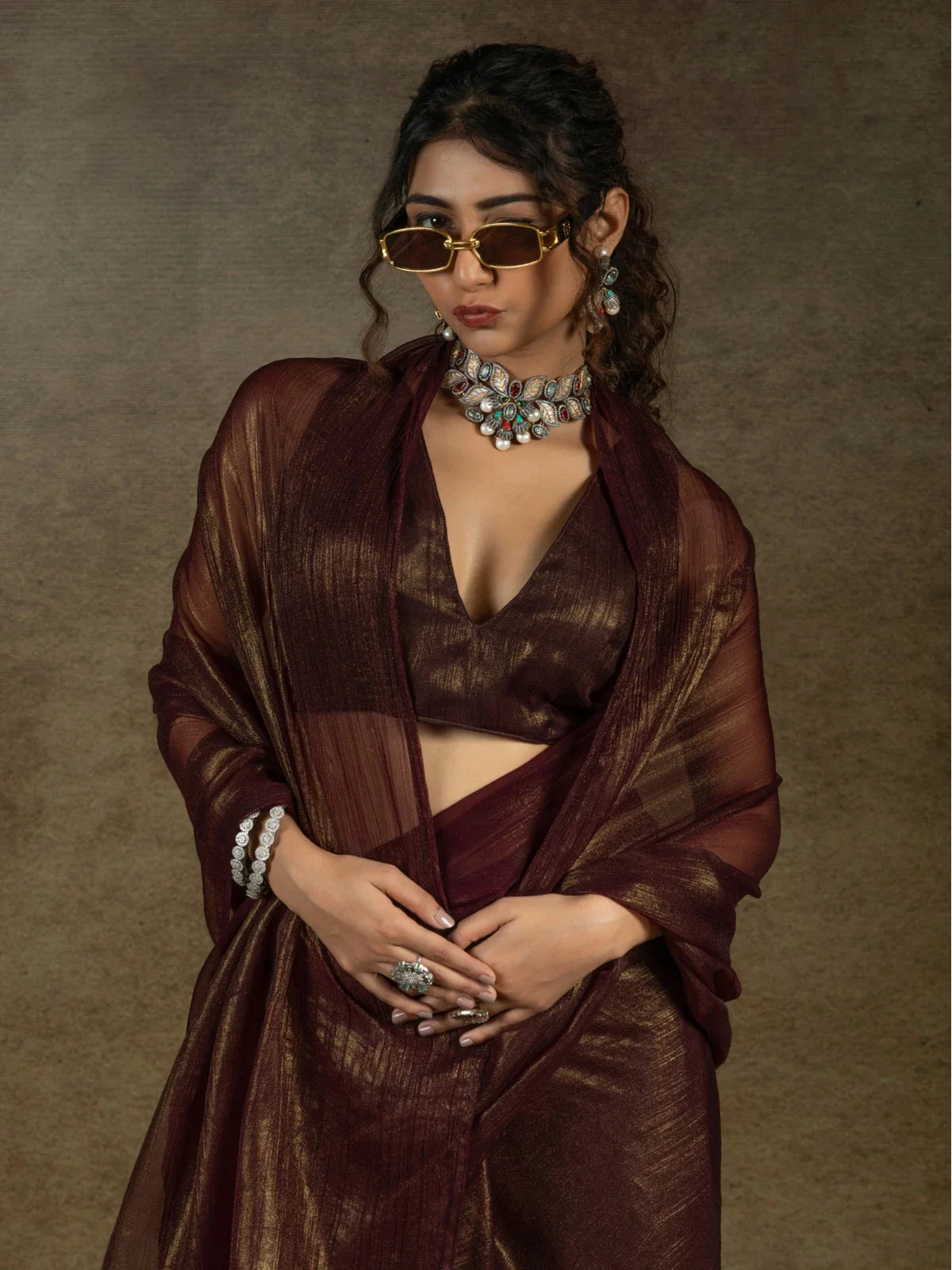Tarani maroon satin chiffon saree upper body close-up showing shimmer blouse and jewellery styling