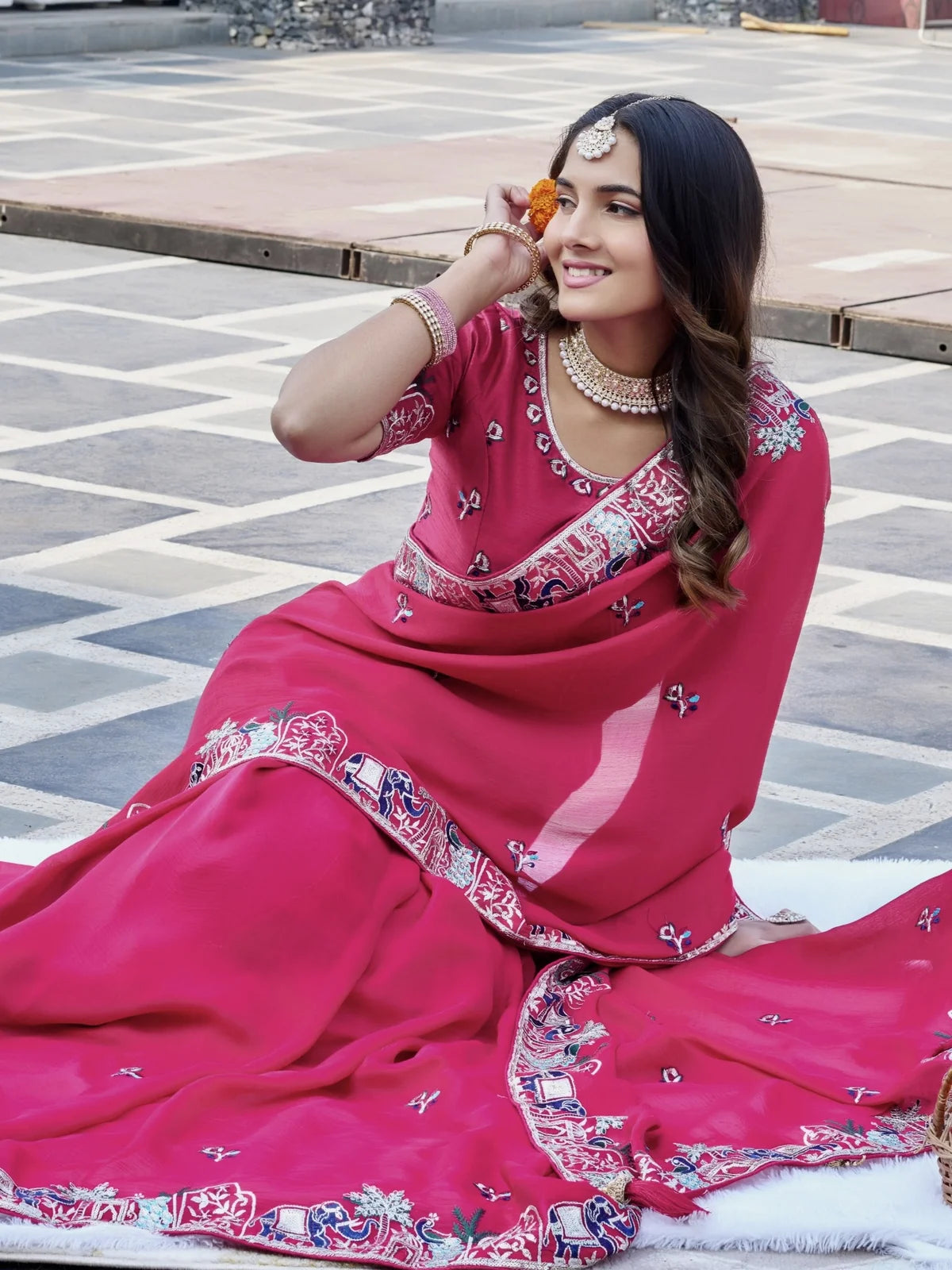Tarani festive satin chiffon saree with embroidered pallu elegant side sitting pose